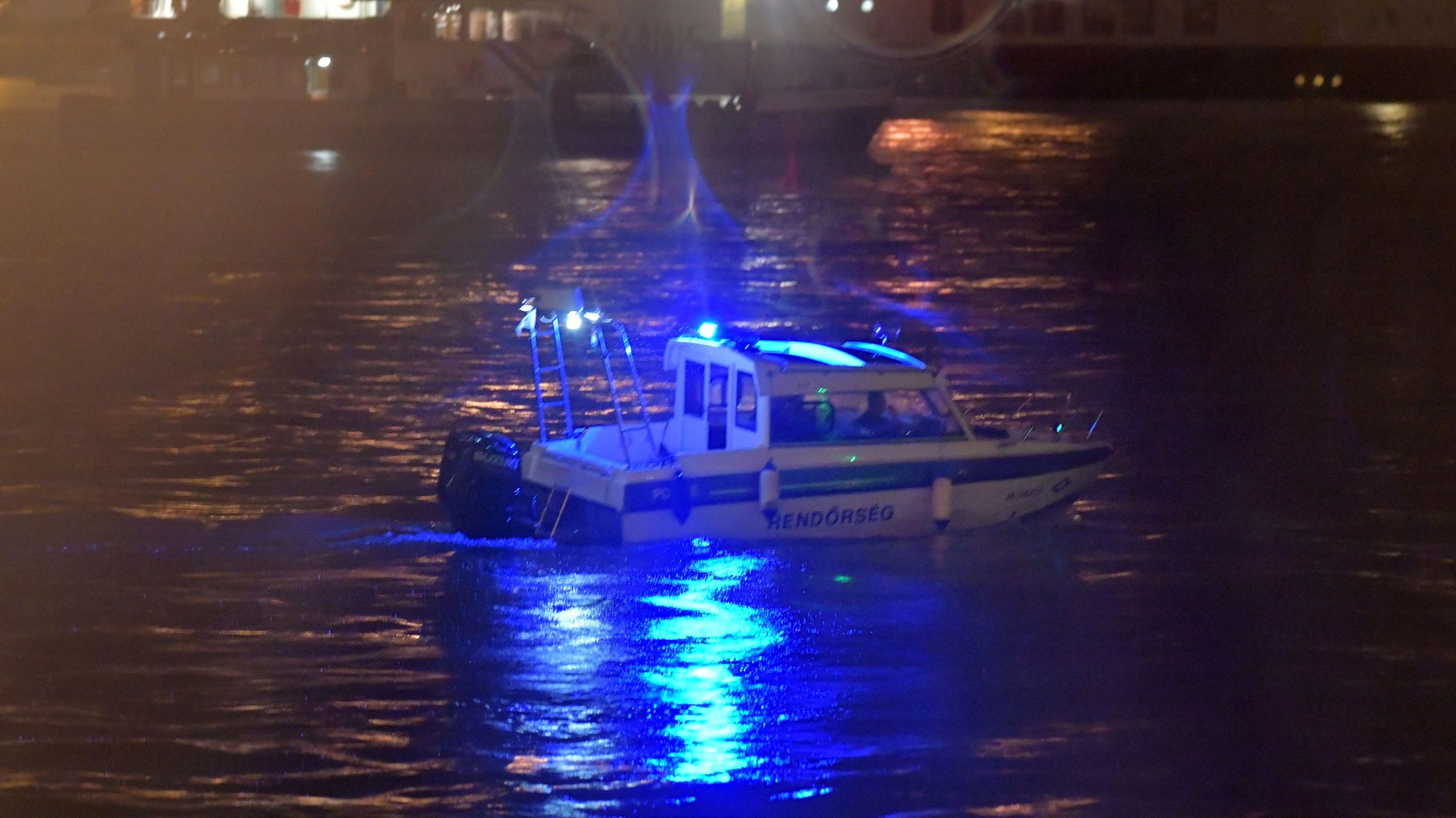 Crew members of a police boat search for survivors after the Hungarian 'Hableany' (Mermaid) riverboat capsized after a collision on the Danube River in Budapest on May 30, 2019. - Seven South Korean tourists were killed and 19 missing after a pleasure boat capsized on the Danube in the Hungarian capital, the foreign ministry said on May 30, 2019. (Credit: GERGELY BESENYEI/AFP/Getty Images)