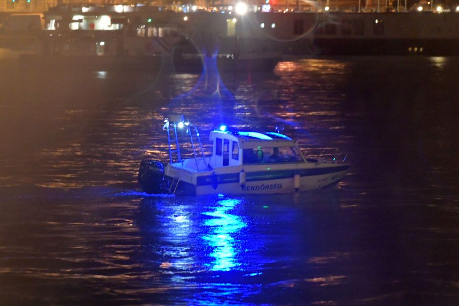 Crew members of a police boat search for survivors after the Hungarian 'Hableany' (Mermaid) riverboat capsized after a collision on the Danube River in Budapest on May 30, 2019. - Seven South Korean tourists were killed and 19 missing after a pleasure boat capsized on the Danube in the Hungarian capital, the foreign ministry said on May 30, 2019. (Credit: GERGELY BESENYEI/AFP/Getty Images)