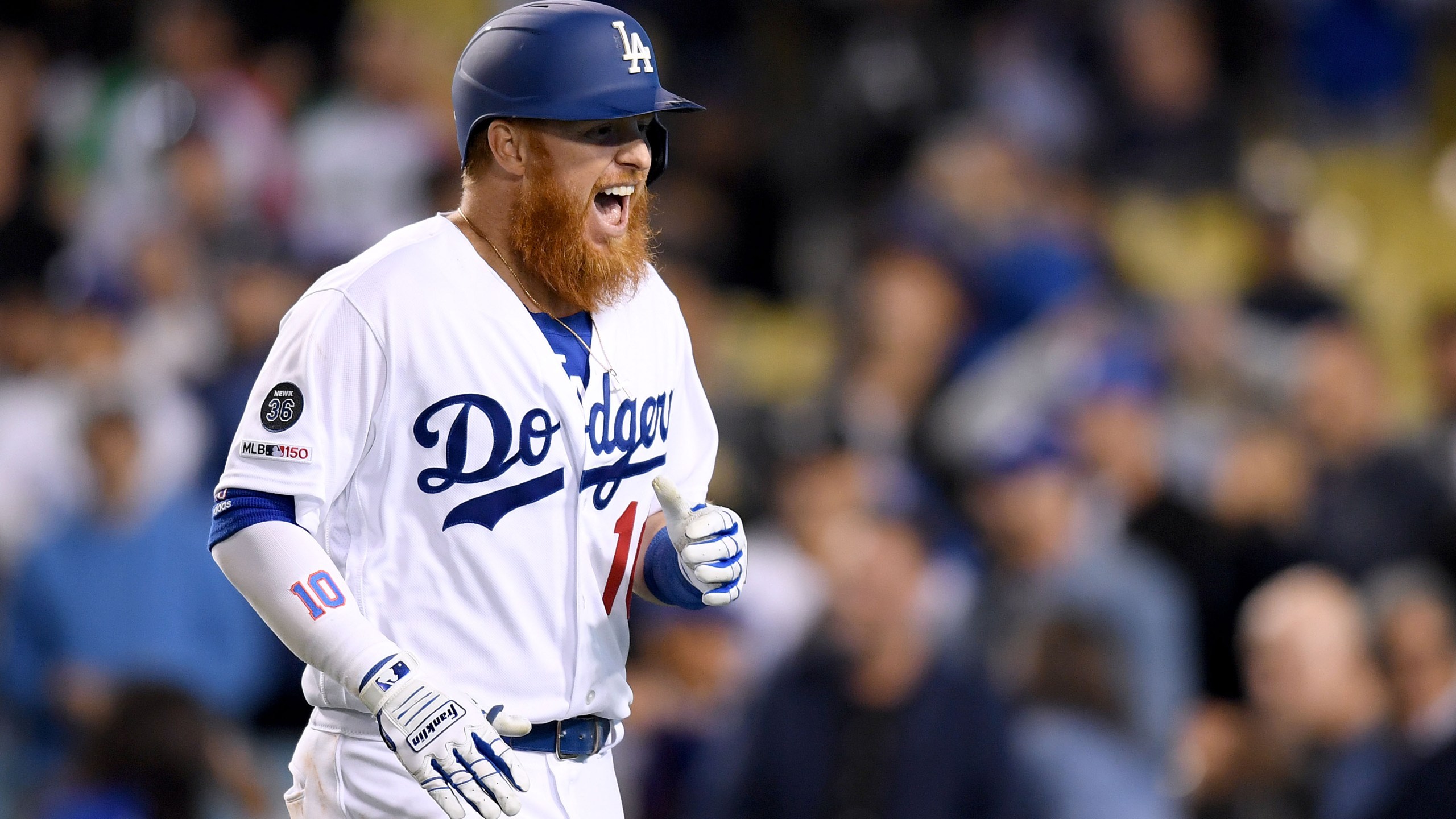 Justin Turner #10 of the Los Angeles Dodgers reacts to his two-run home run, to take a 9-4 lead over the Atlanta Braves, during the eighth inning at Dodger Stadium on May 8, 2019. (Credit: Harry How/Getty Images)