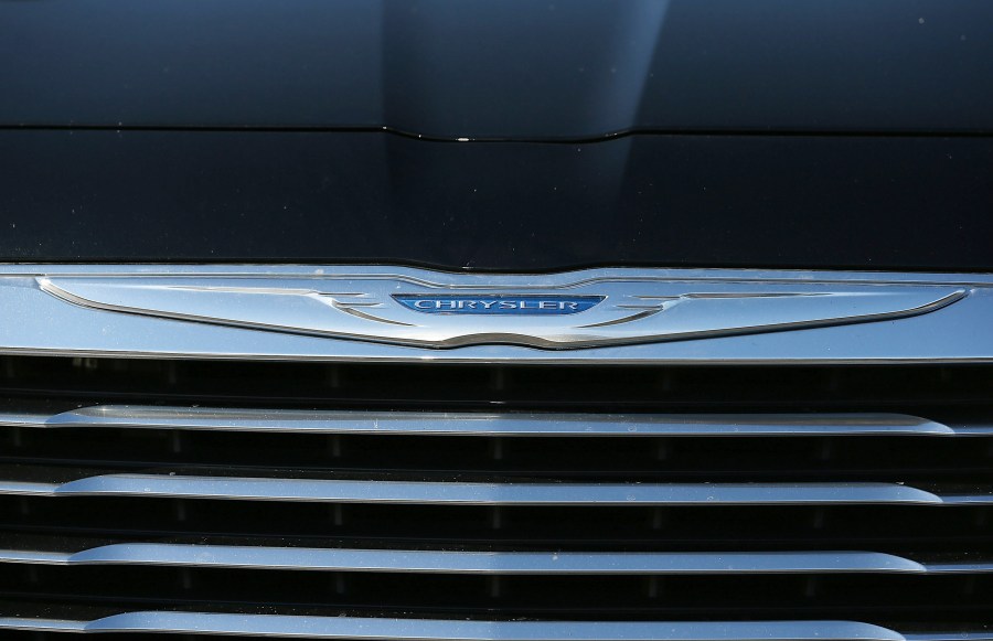 The Chrysler logo is displayed on the front of a brand new car on Jan. 3, 2013, in Colma, California. (Credit: Justin Sullivan/Getty Images)