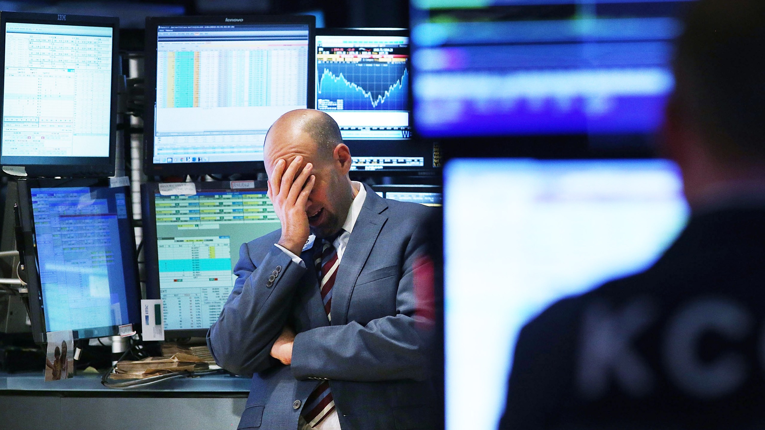 A trader works on the floor of the New York Stock Exchange (NYSE) on October 15, 2014 in New York City. (Credit: Spencer Platt/Getty Images)