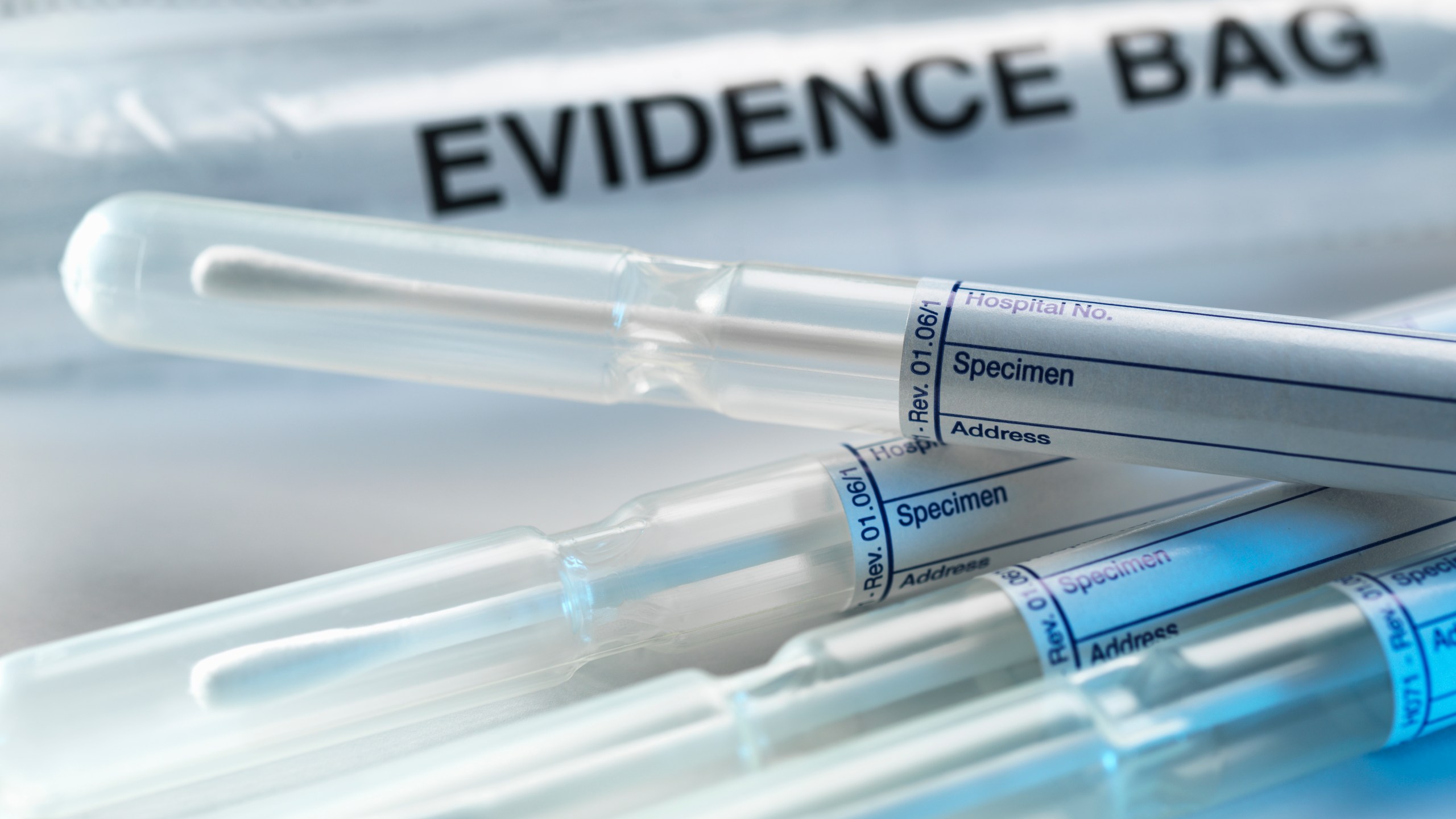 A row of samples from a crime scene on top of genetic testing results are pictured in this undated photo. (Credit: Getty Images)