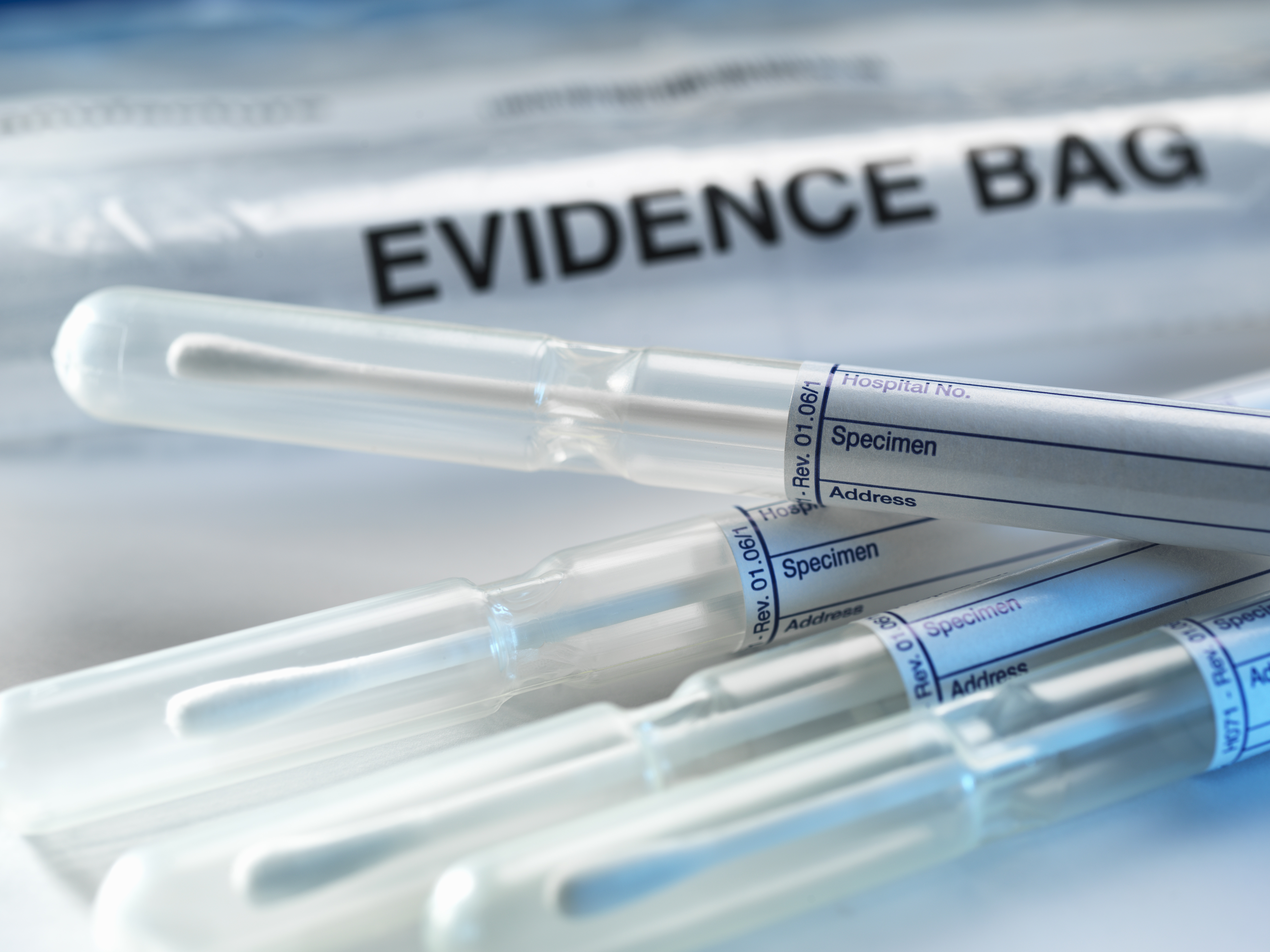 A row of samples from a crime scene on top of genetic testing results are pictured in this undated photo. (Credit: Getty Images)