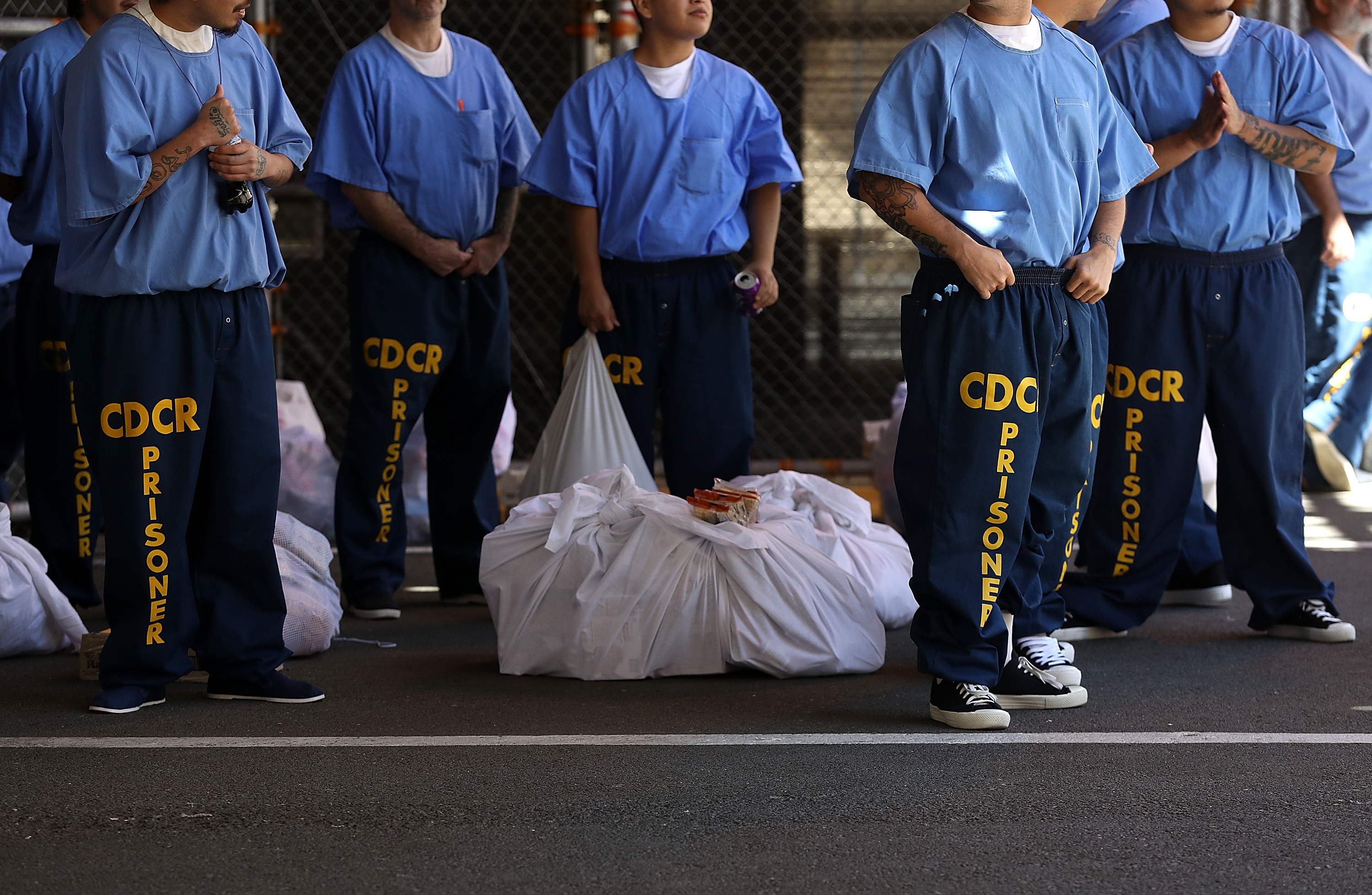 Inmates at San Quentin State Prison wait in line on Aug. 15, 2016. (Justin Sullivan / Getty Images)