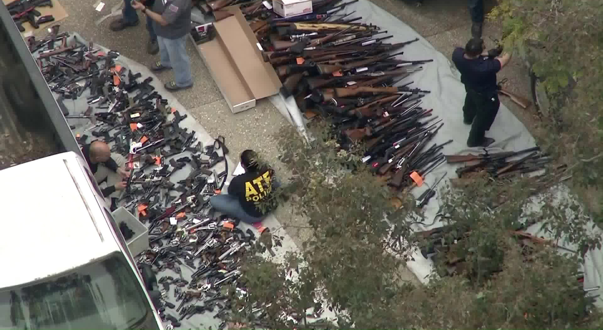 ATF officials investigate after dozens of guns are found in a Bel-Air home on May 8, 2019. (Credit: KTLA)