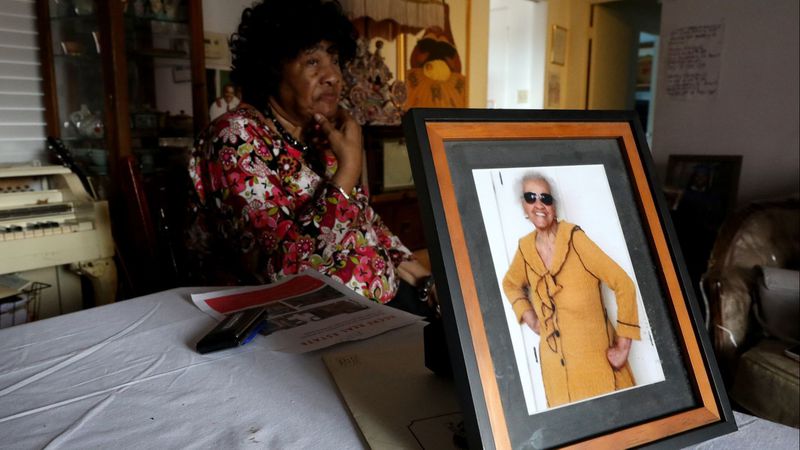 Thelma Smith, who has been living at her Ladera Heights home for 30 years, is seen in a photo pictured on the right. She was being evicted from the residence in May 2019 so the landlord's daughter could move in, drawing concern from her longtime neighbor, Pauline Cooper, who is seen on the left. (Credit: Gary Coronado/ Los Angeles Times)