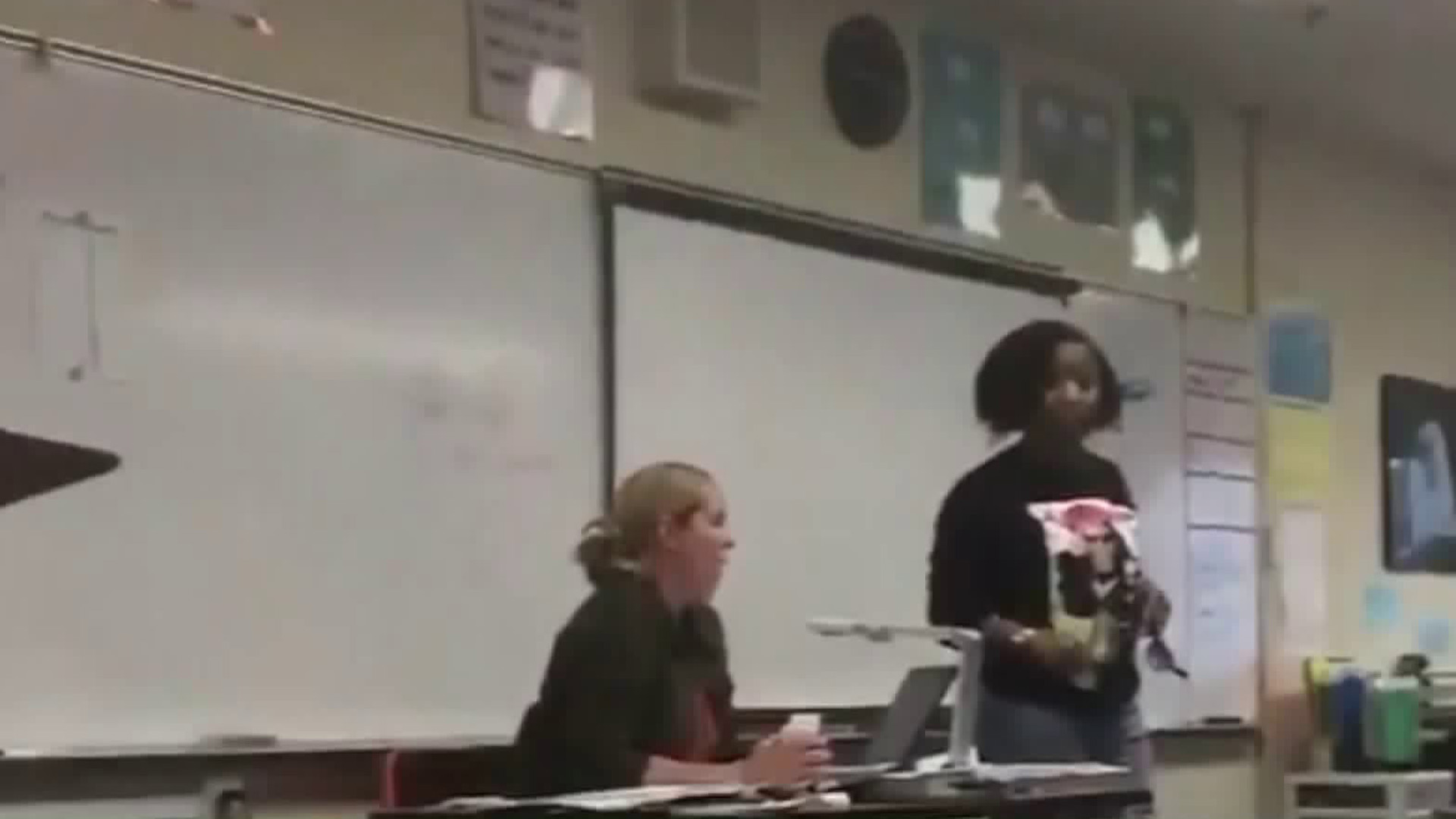 A mother is seen confronting students at Niguel Hills Middle School in a video obtained by KTLA.