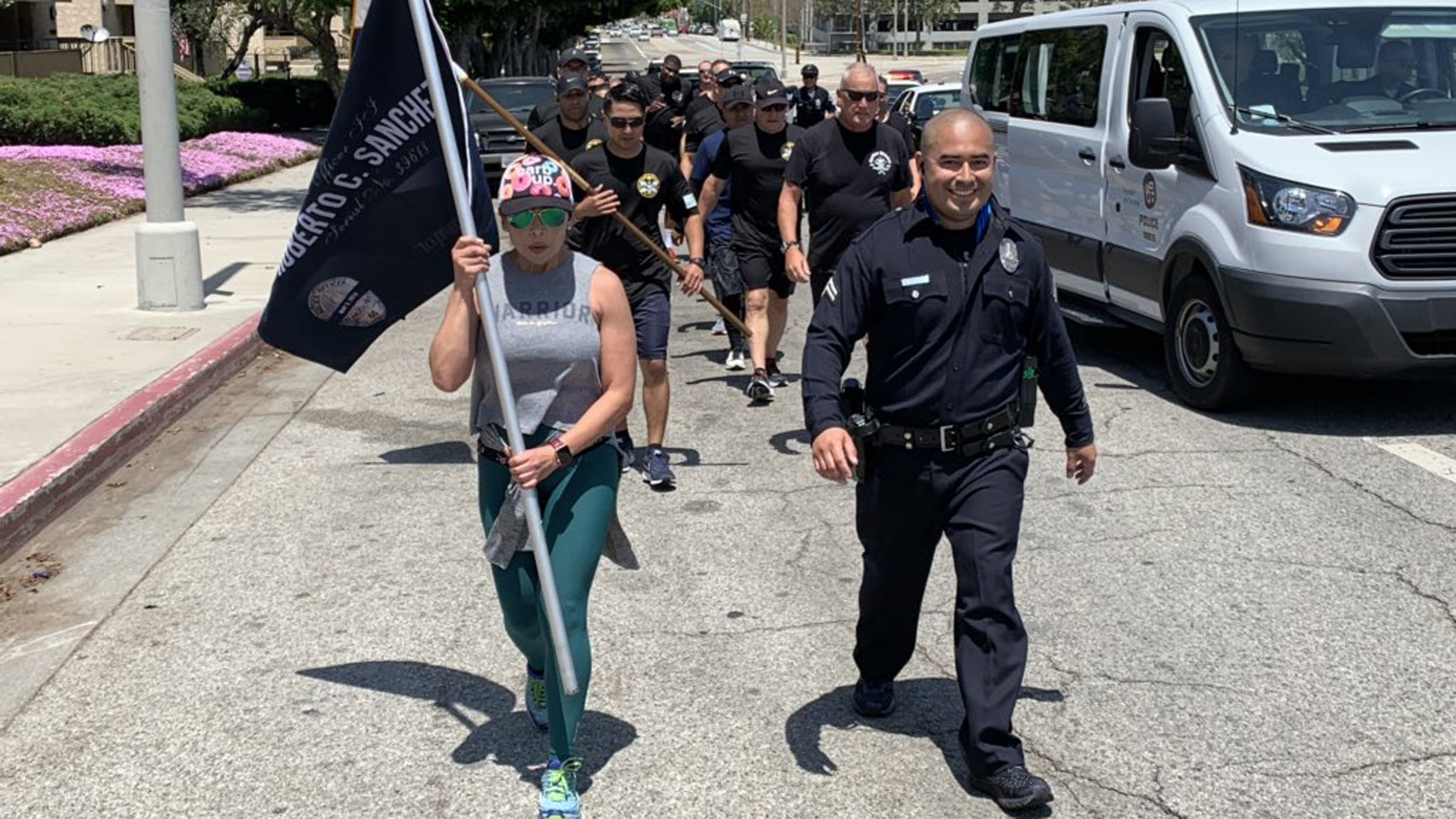 Los Angeles Police Department Officer Richard Medina ran 24 miles in full uniform to honor his partner, Officer Roberto Sanchez, who was killed in a crash during a pursuit on May 3, 2014. (Credit: LAPD)