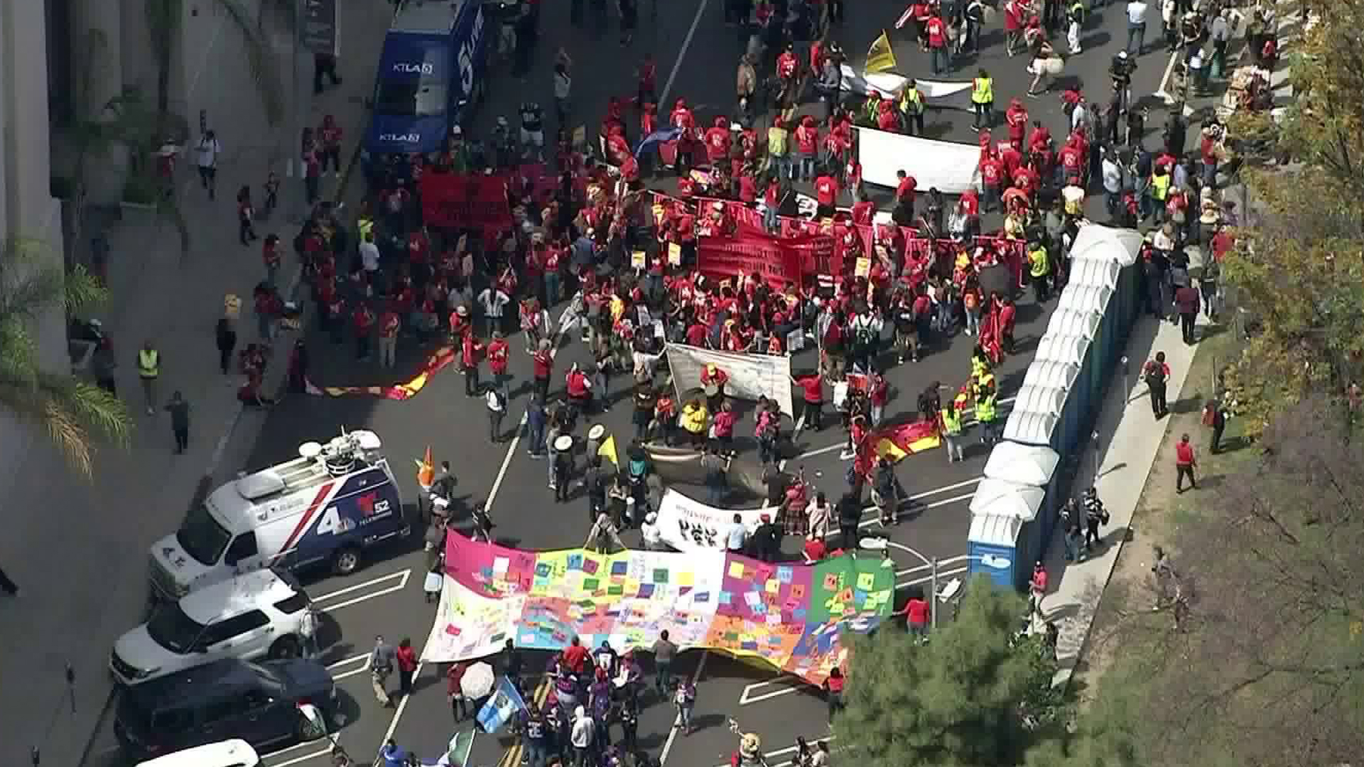 Labor rights' advocates and other community groups rallied in celebration of "May Day" in Los Angeles' MacArthur Park on May 1, 2019. (Credit: KTLA)