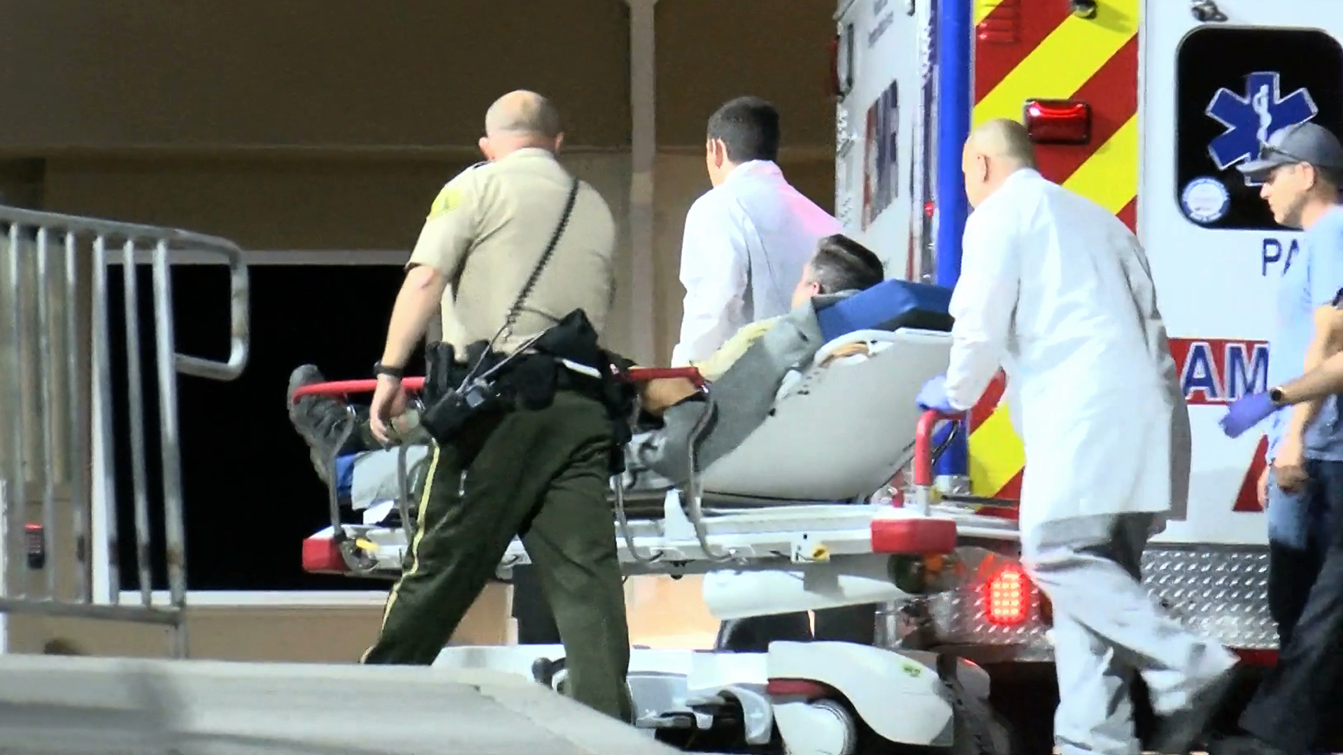 A Riverside County sheriff's deputy is wheeled into the emergency room at a hospital in Riverside after being wounded in a shooting in Lake Mathews on June 11, 2019. (Credit: OC Hawk)