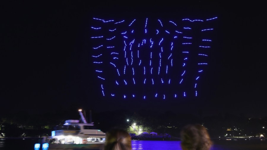 A hundred illuminated drones perform a choreographed routine over Sydney Harbour on June 8, 2016 in Sydney, Australia. (Credit: Cameron Spencer/Getty Images)