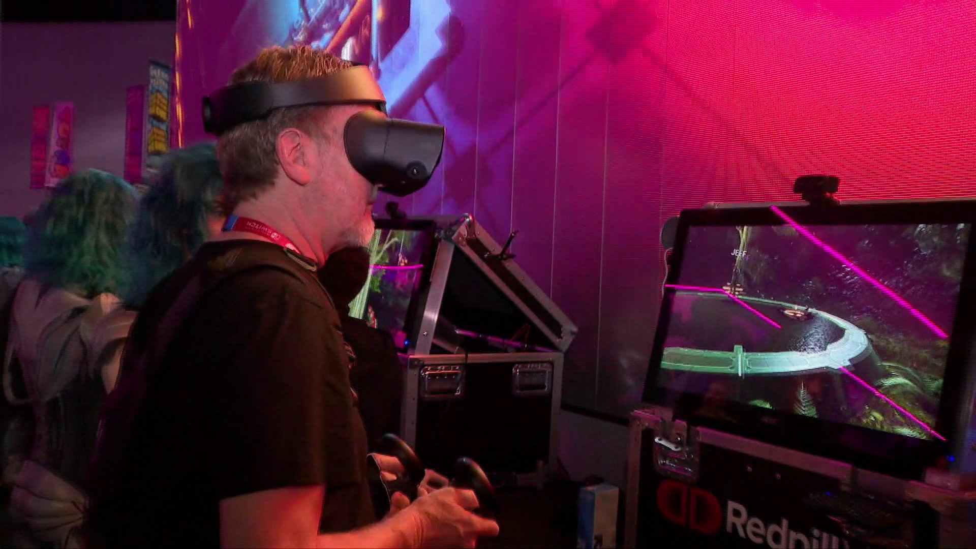 A man checks out a headset at E3 in Los Angeles on June 11, 2019. (Credit: KTLA)