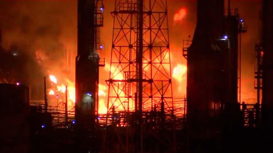 Fire officials work to contain blaze at an oil refining complex in Philadelphia. (Credit: KYW via CNN Wire)