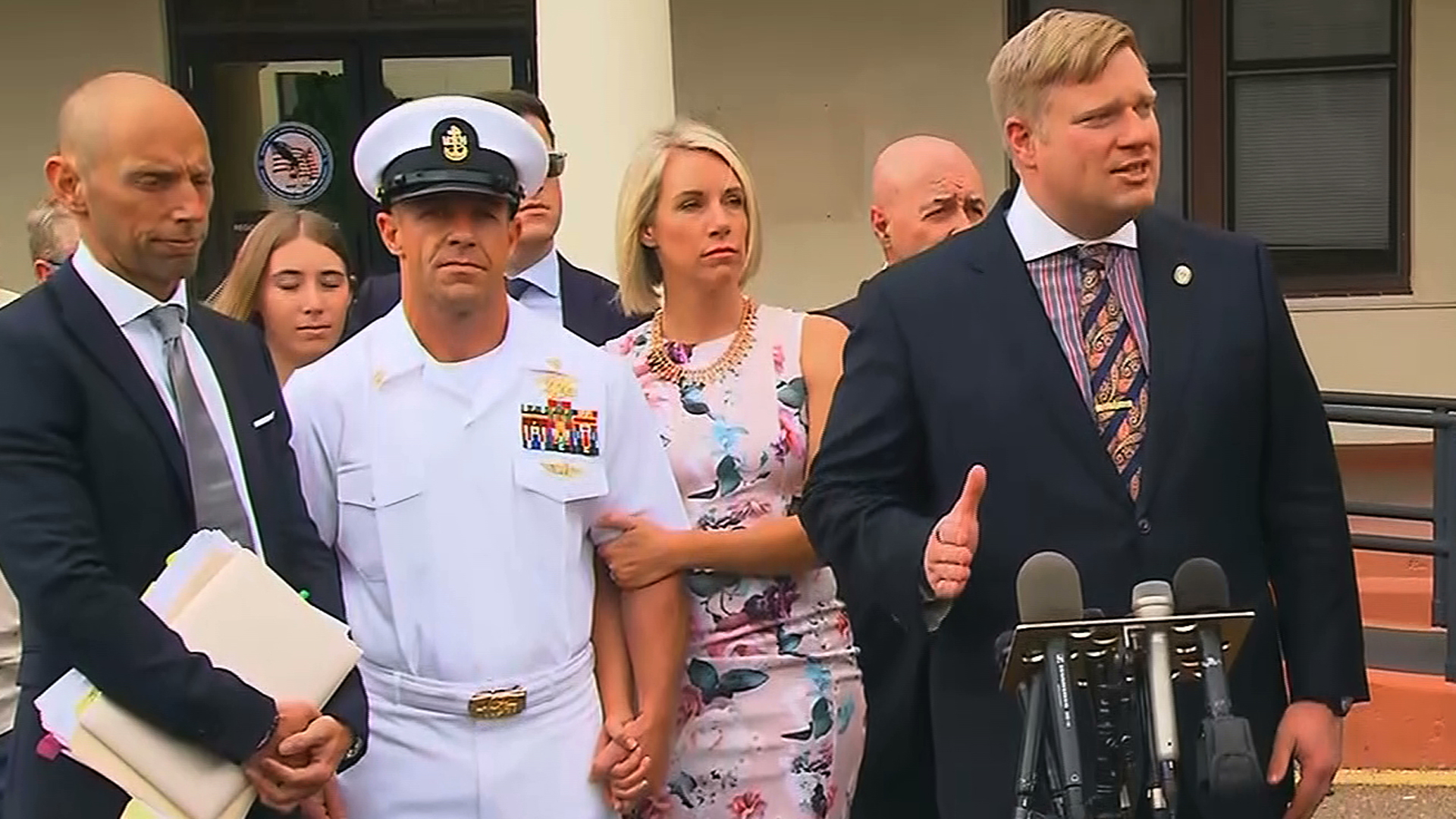 Navy Special Operations Chief Edward Gallagher, second from left, stands alongside his wife as his attorney Timothy Parlatore addresses the media following day three of the SEAL’s war crimes trial in San Diego on June 20, 2019. (Credit: CNN)