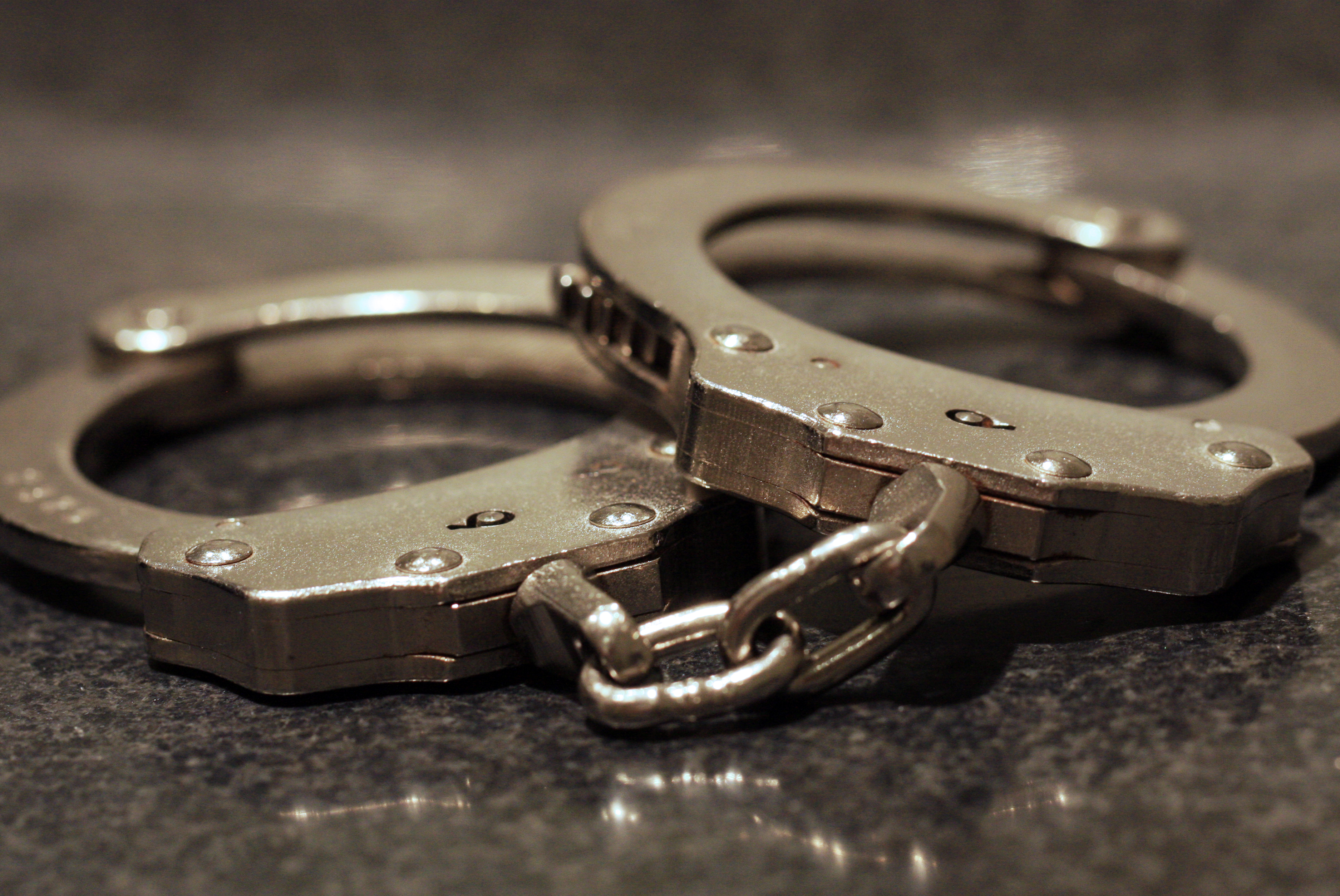 Handcuffs sit on a table in this file photo. (Credit: Getty Images)