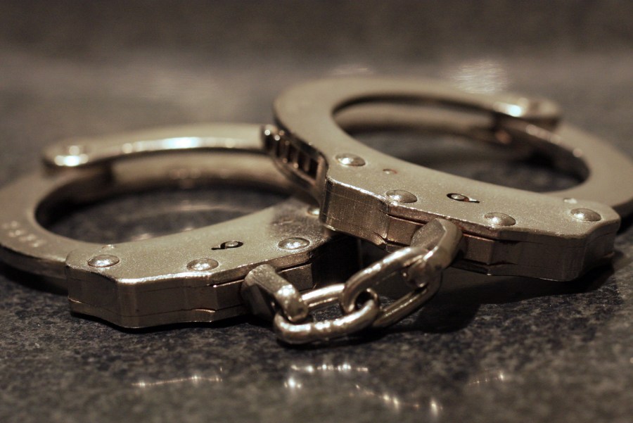 Handcuffs sit on a table in this file photo. (Credit: Getty Images)