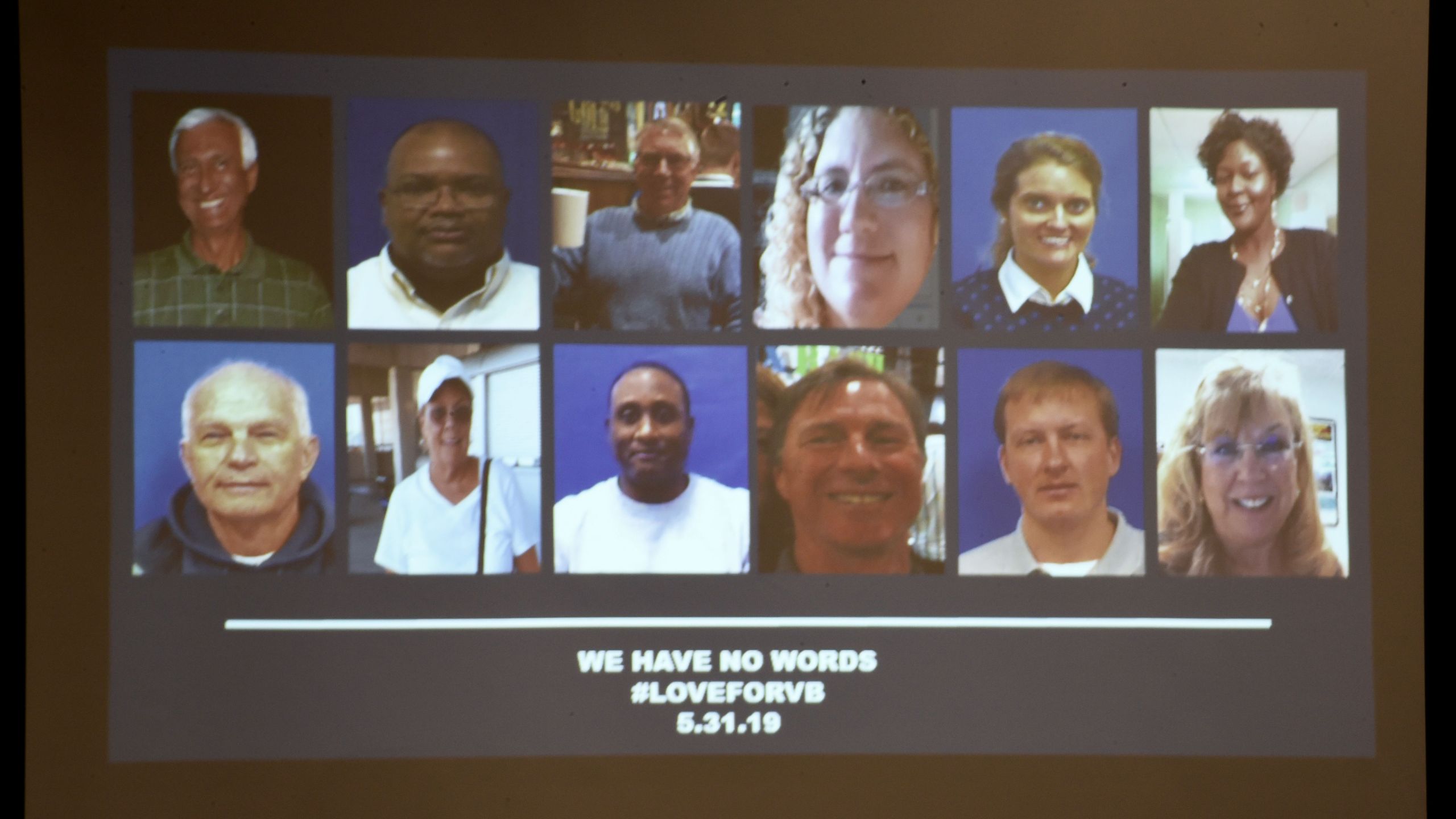 A slide of the victims in the May 31, 2019 mass shooting at a Virginia Beach, Virginia municipal building is shown during a press conference on June 1, 2019. (Credit: ERIC BARADAT/AFP/Getty Images)