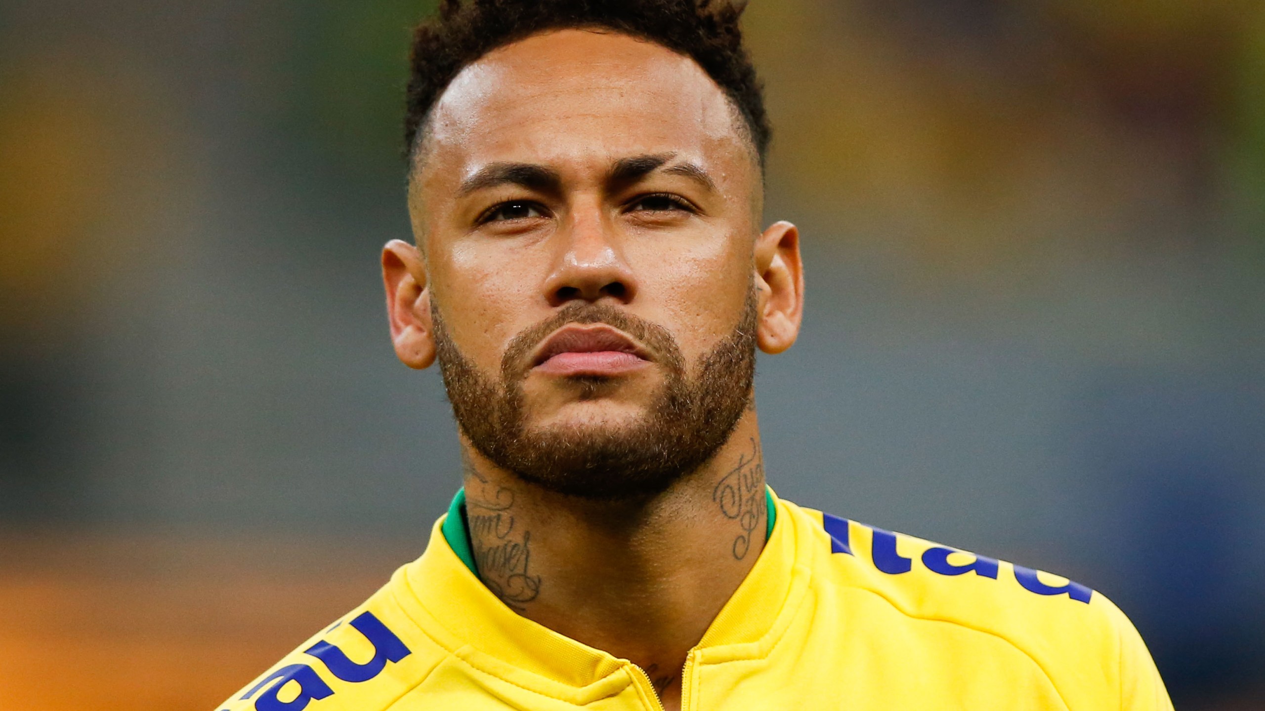 Neymar Jr. of Brazil looks on during the national anthem before the friendly match against Qatar at Mane Garrincha Stadium on June 5, 2019, in Brasilia, Brazil. (Credit: Alexandre Schneider/Getty Images)