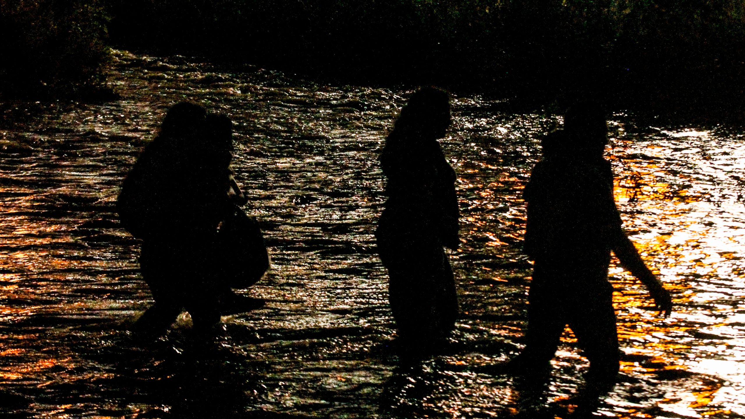 Central American migrants cross the Rio Grande in Ciudad Juarez, Mexico, on June 12, 2019, before turning themselves to U.S. Border Patrol agents to ask for asylum. (Credit: Herika Martinez / AFP / Getty Images)