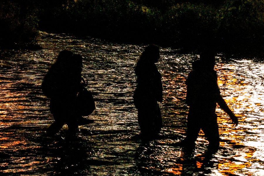 Central American migrants cross the Rio Grande in Ciudad Juarez, Mexico, on June 12, 2019, before turning themselves to U.S. Border Patrol agents to ask for asylum. (Credit: Herika Martinez / AFP / Getty Images)