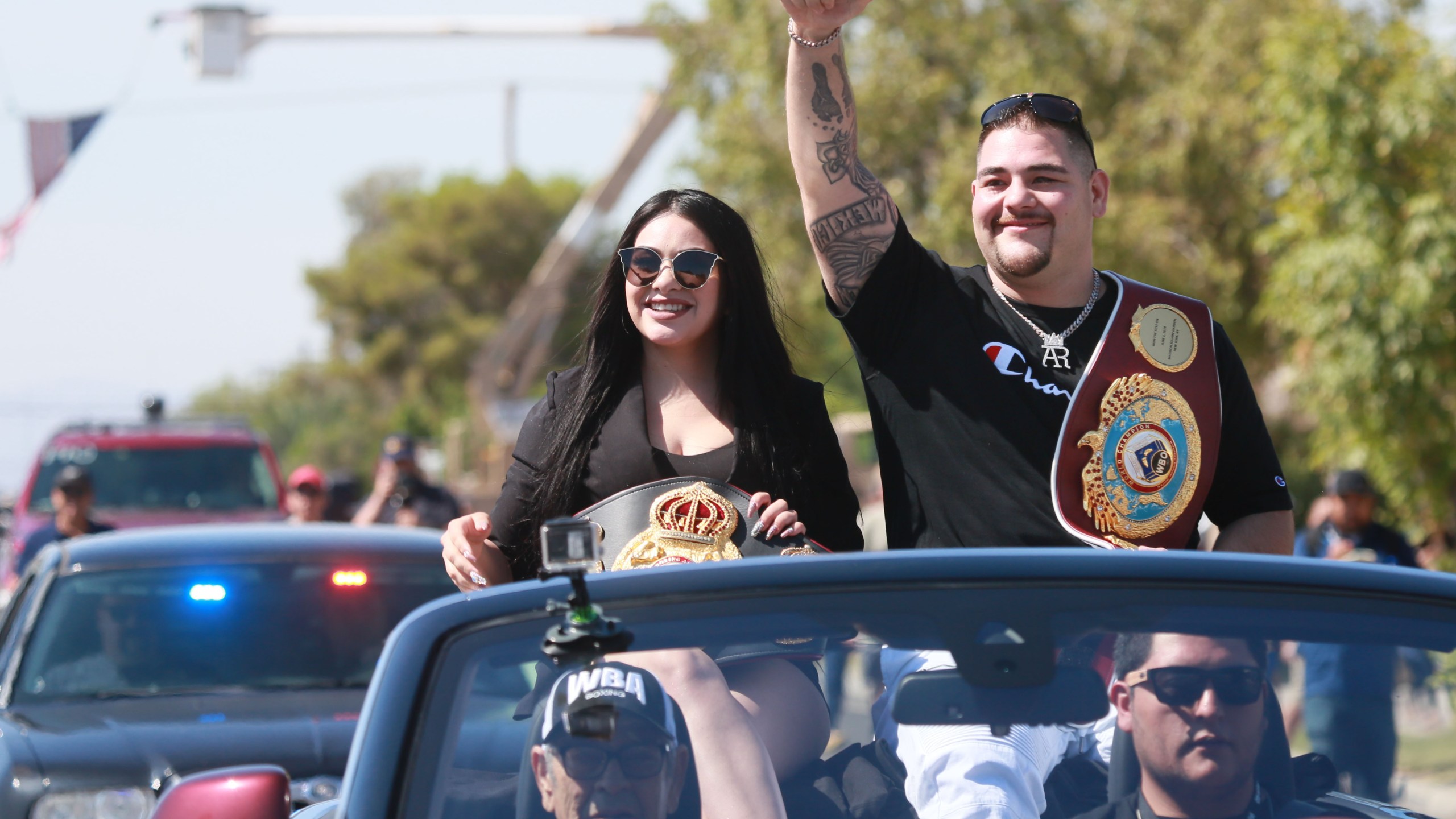 Heavyweight boxing champion Andy Ruiz Jr. and his wife Julie Ruiz wave to supporters during a parade in his honor on Saturday, June 22, 2019 in Imperial. (Credit: SANDY HUFFAKER/AFP/Getty Images)