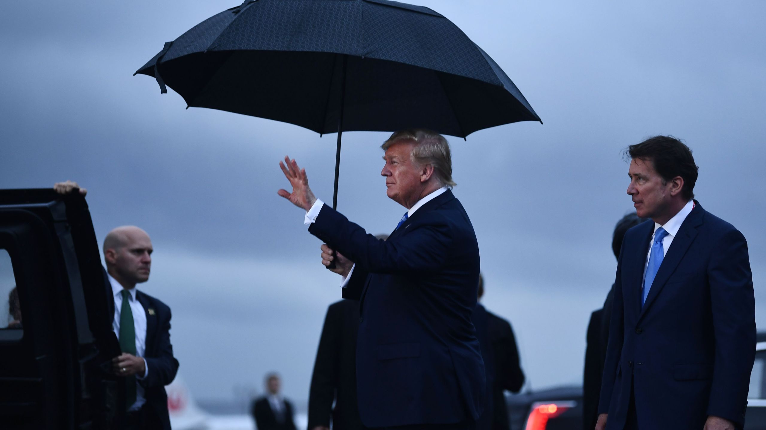 US President Donald Trump gestures as he arrives at Osaka International Airport in Itami, Hyogo prefecture, on June 27, 2019 ahead of the G20 Osaka Summit. (Credit: BRENDAN SMIALOWSKI/AFP/Getty Images)