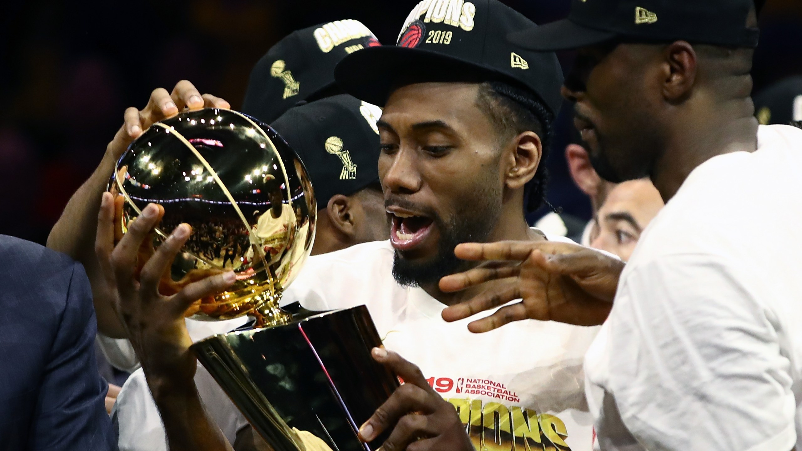 Kawhi Leonard #2 of the Toronto Raptors celebrates with the Larry O'Brien Championship Trophy after his team defeated the Golden State Warriors to win Game Six of the 2019 NBA Finals at ORACLE Arena on June 13, 2019 in Oakland, California. (Credit: Ezra Shaw/Getty Images)