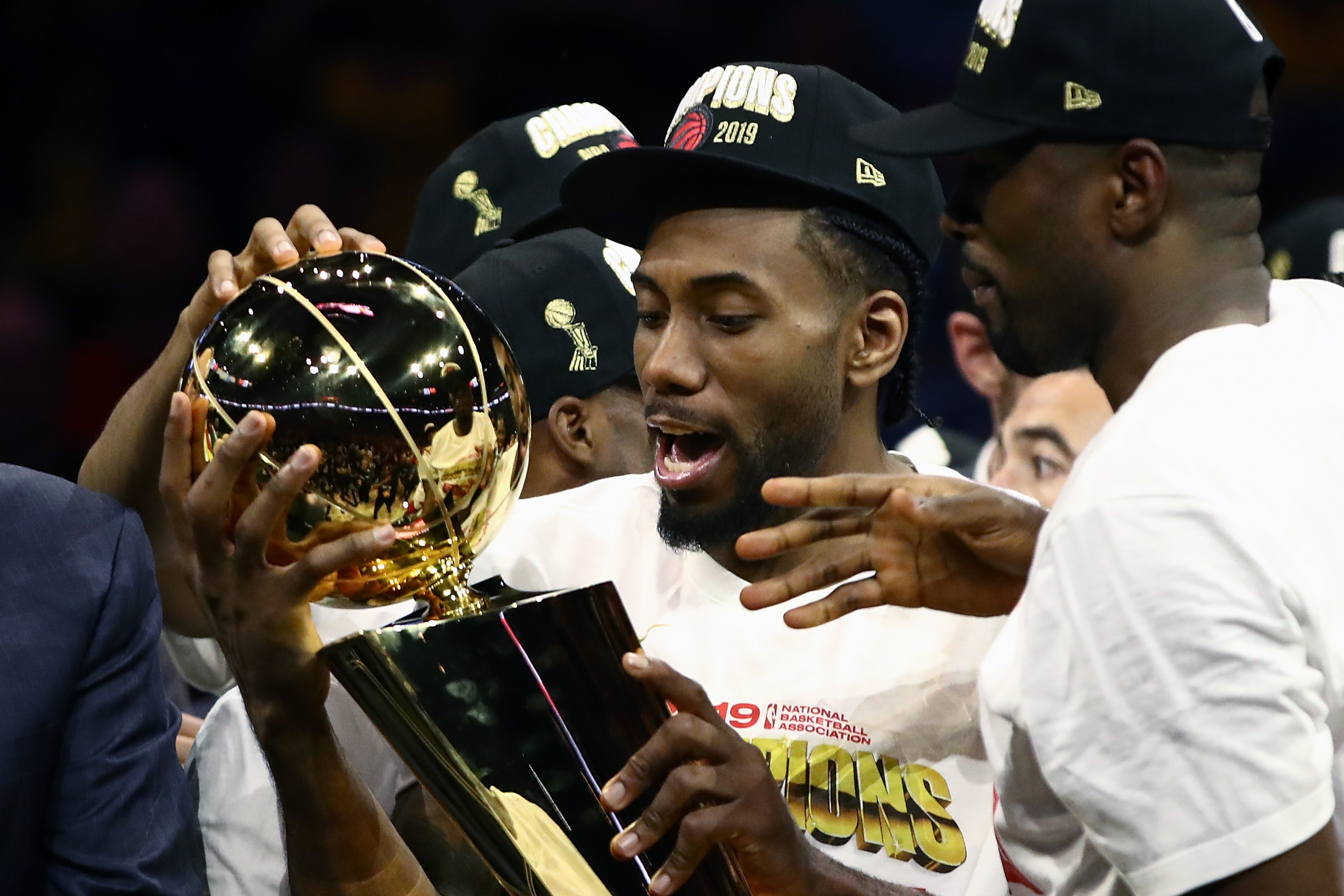 Kawhi Leonard #2 of the Toronto Raptors celebrates with the Larry O'Brien Championship Trophy after his team defeated the Golden State Warriors to win Game Six of the 2019 NBA Finals at ORACLE Arena on June 13, 2019 in Oakland, California. (Credit: Ezra Shaw/Getty Images)