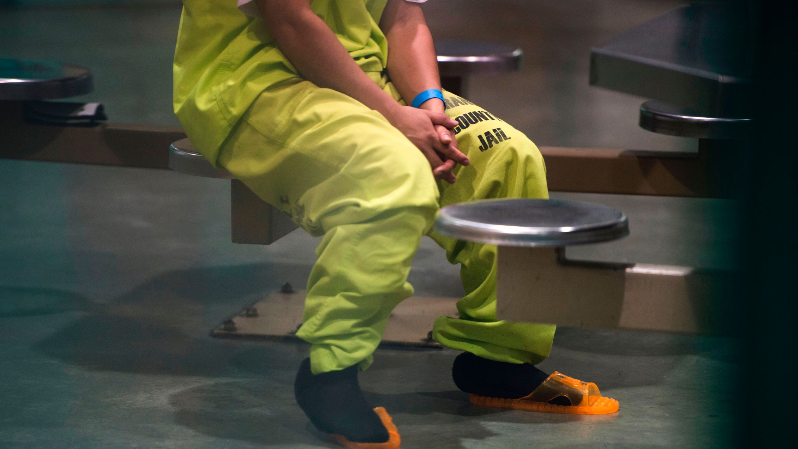 An immigration detainee sits in a high security unit at the Theo Lacy Facility, a county jail that also houses immigration detainees arrested by U.S. Immigration and Customs Enforcement, March 14, 2017 in Orange, California. (Credit: ROBYN BECK/AFP/Getty Images)