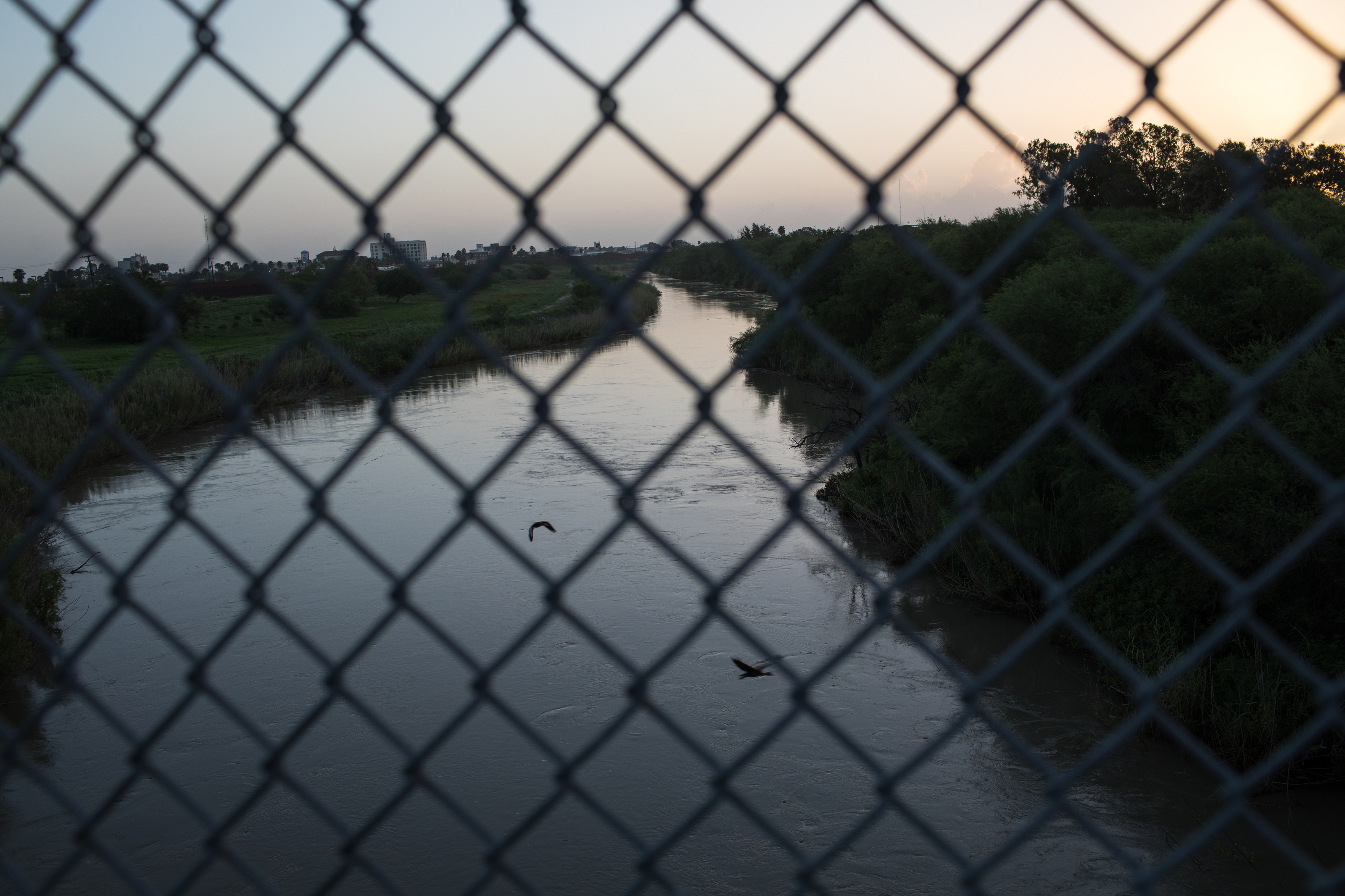 The Rio Grande flows under the Brownsville & Matamoros International Bridge on June 28, 2018, near Brownsville, Texas. (Credit: Tamir Kalifa/Getty Images)