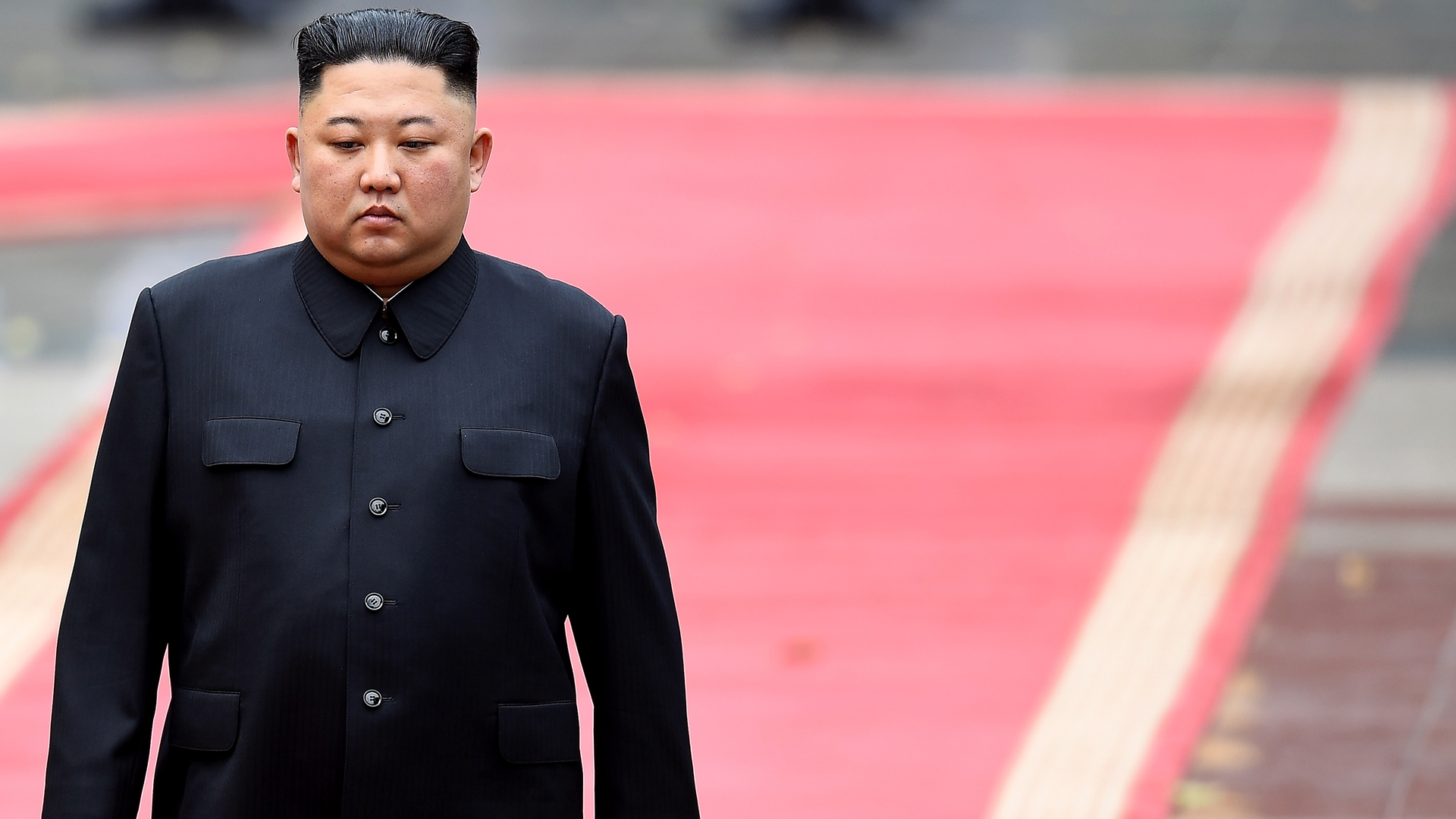 North Korea's leader Kim Jong Un attends a welcoming ceremony and review an honour guard at the Presidential Palace in Hanoi on March 1, 2019. (Credit: Manan VatsayanaAFP/Getty Images)