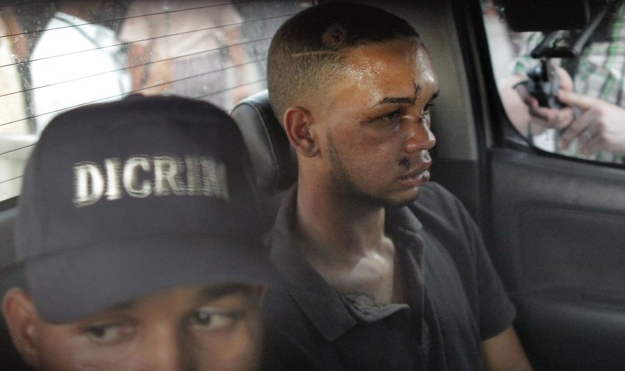 Eddy Vladimir Féliz Garcia, in custody in connection with the shooting of former Boston Red Sox slugger David Ortiz, is transferred by police to court. (Credit: Roberto Guzman/AP)