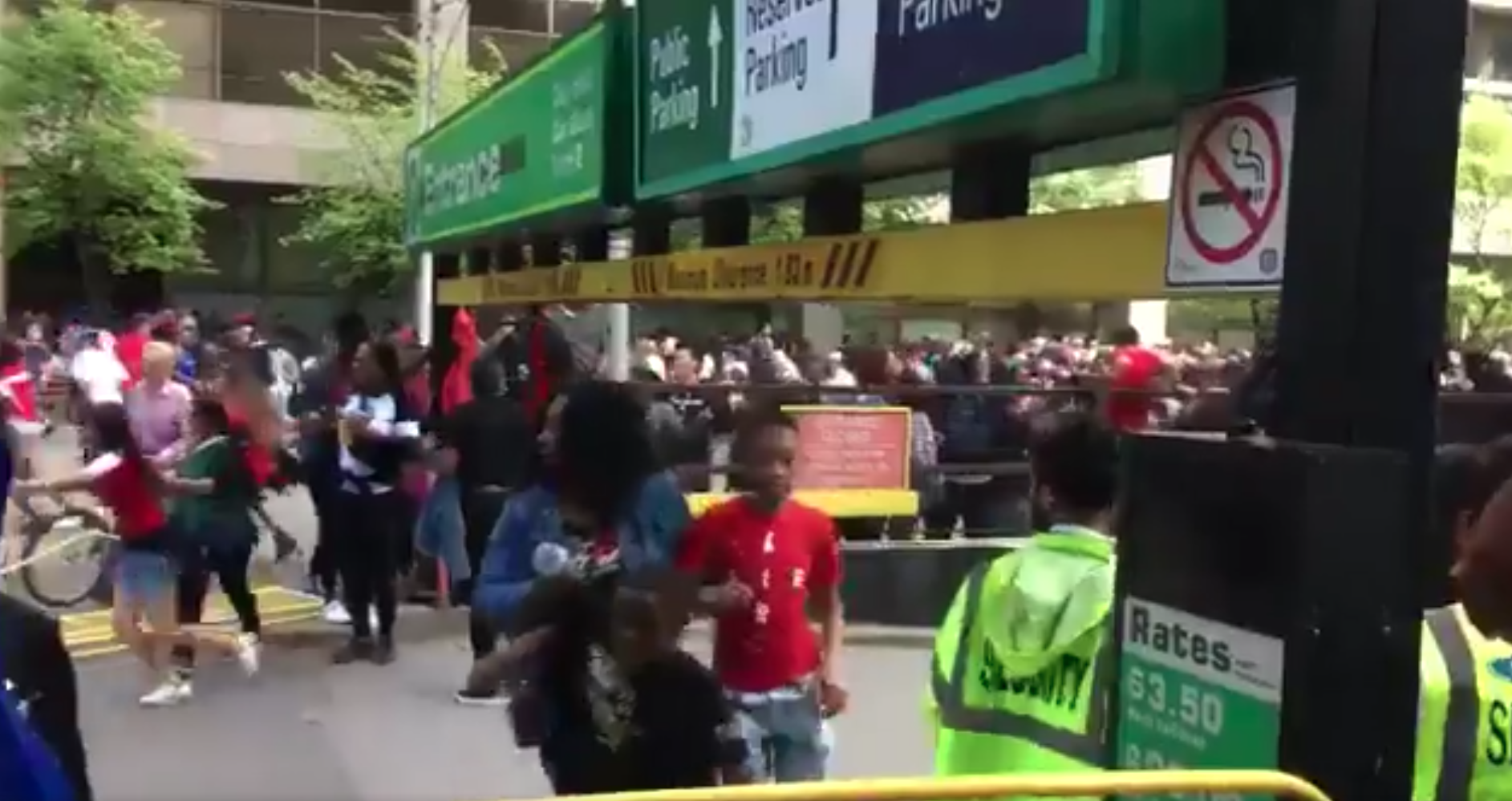 People are seen running from a Toronto Raptors victory parade after reports of shots fired on June 17, 2019, in Canada. (Credit: The Toronto Sun)