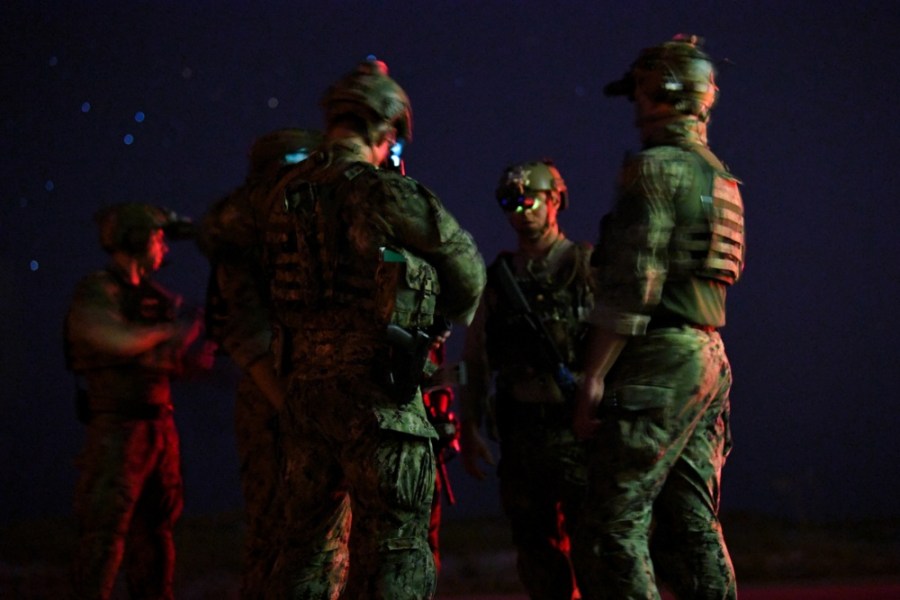 U.S. Navy Sea, Air, and Land Team members conduct military field operations during exercise Trident 18-4 at Hurlburt Field, Florida, on July 11, 2018. (Credit: Staff Sgt. Corban Lundborg / Air Force)