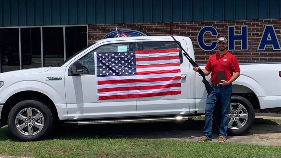 Chatom Ford in Alabama ended a promotion that gave away bibles, American flags and gift certificates for a shotgun to customers who purchased any new or used vehicle throughout July. (Credit: Chatom Ford via CNN)