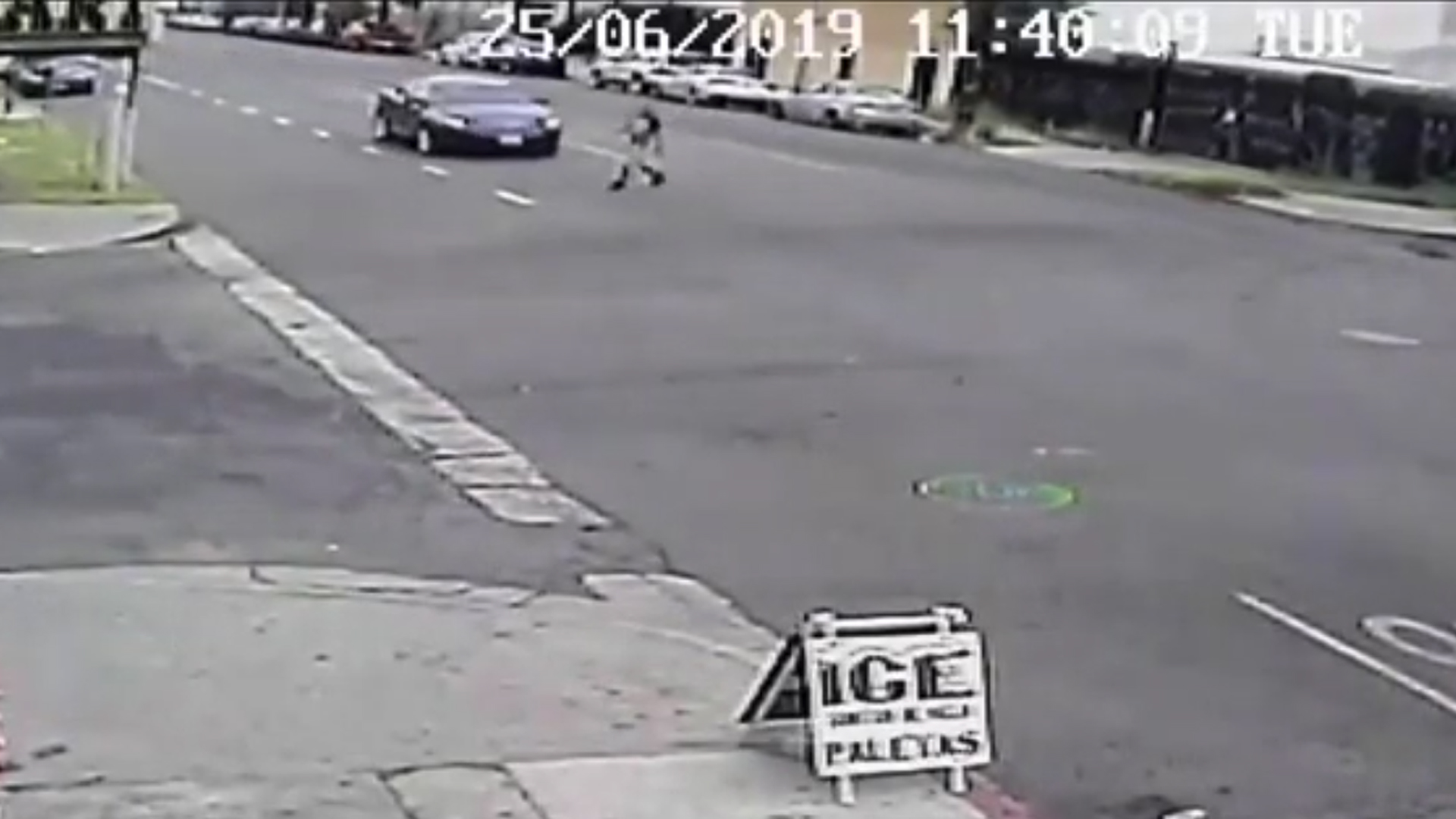 A pedestrian is seen crossing a street in South L.A. just before being struck by a vehicle on June 25, 2019. (Credit: Los Angeles Police Department)