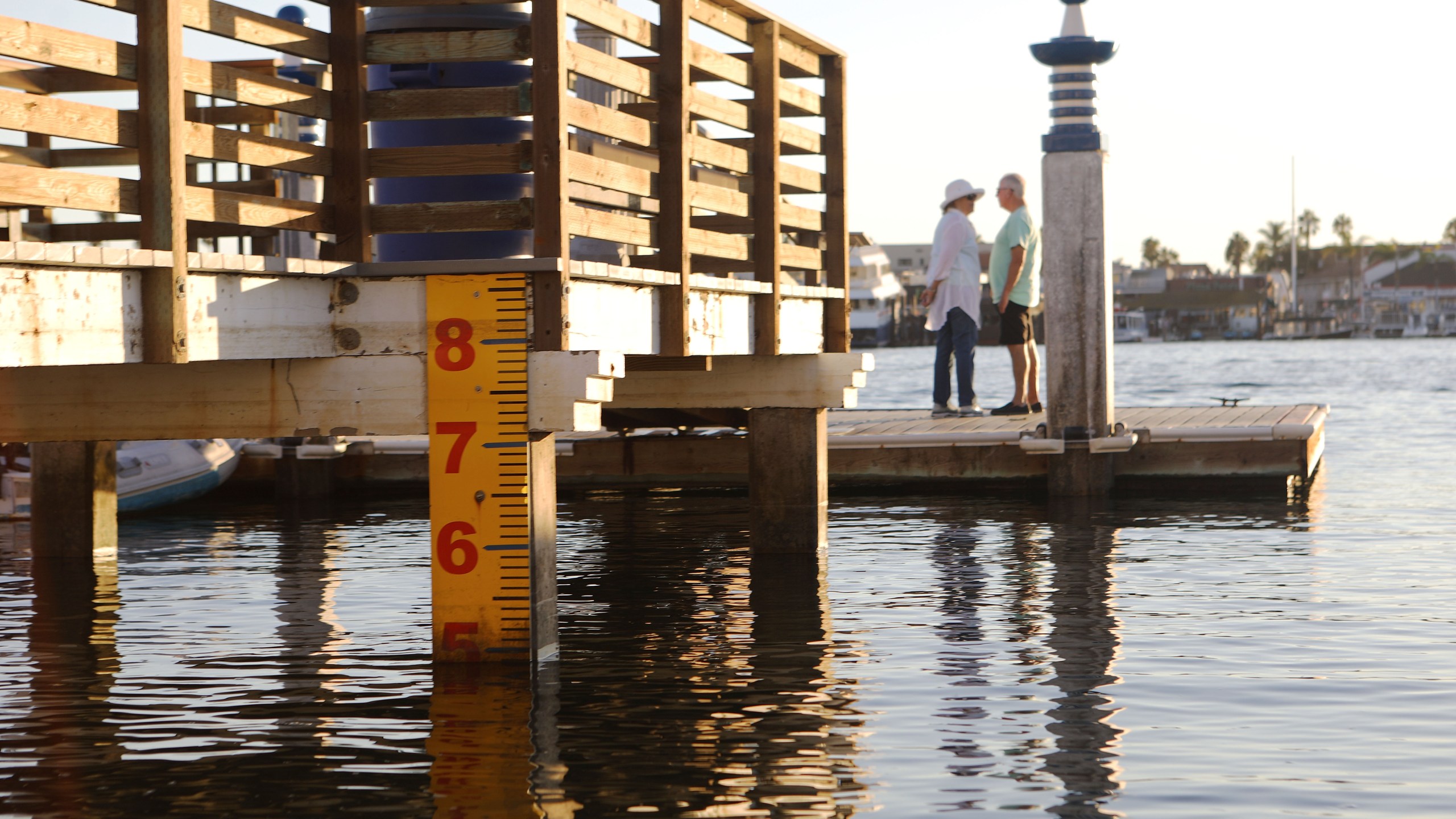 A water level marker is attached to a dock on Orange County's Balboa Island on Oct. 20, 2018, in Newport Beach, after officials raised the island's sea walls by nine inches. (Credit: Mario Tama/Getty Images)