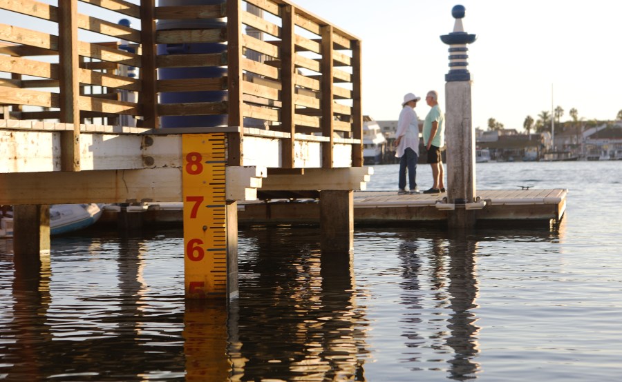 A water level marker is attached to a dock on Orange County's Balboa Island on Oct. 20, 2018, in Newport Beach, after officials raised the island's sea walls by nine inches. (Credit: Mario Tama/Getty Images)