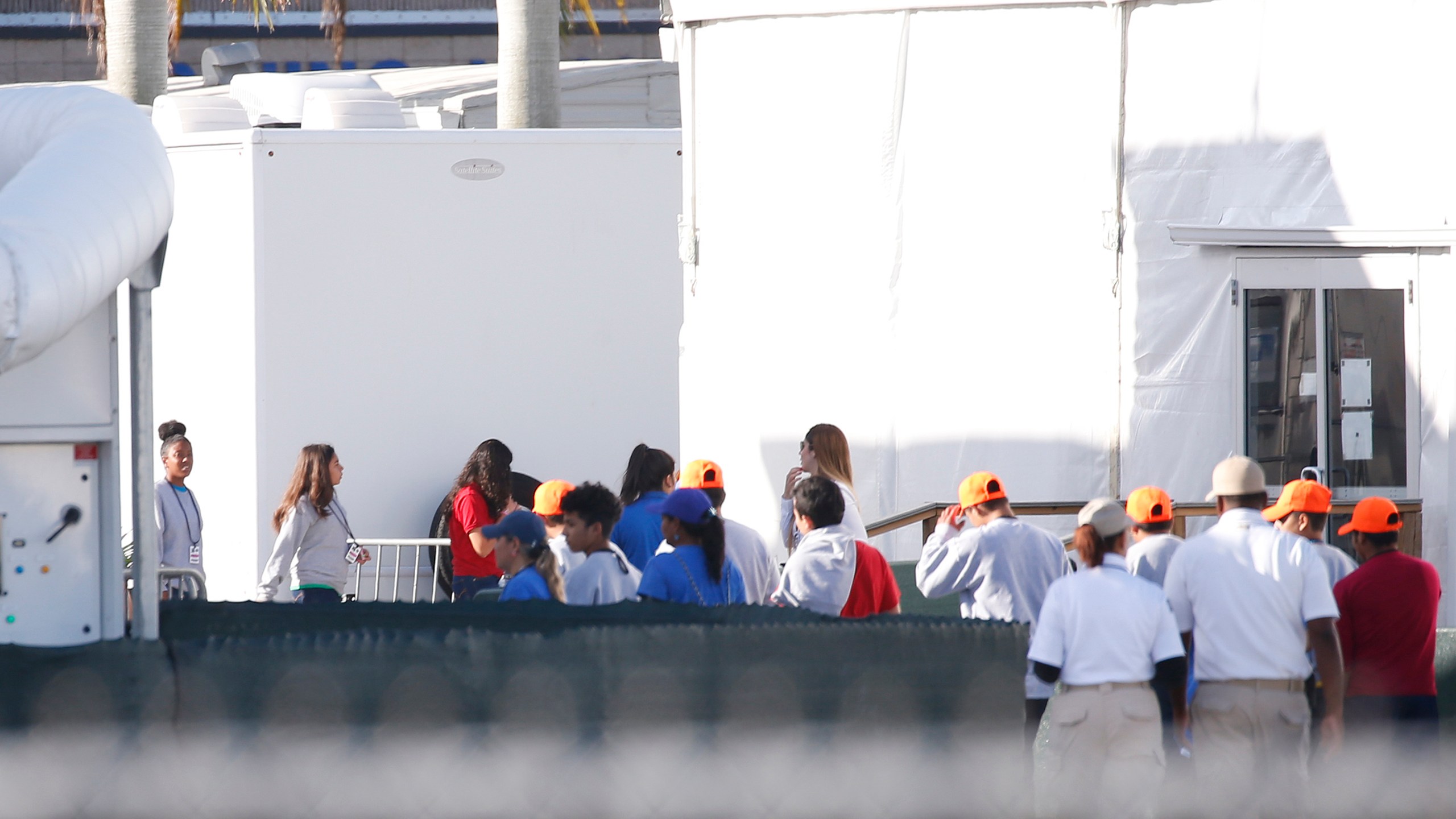 Migrant children who have been separated from their families can be seen in tents at a detention center in Homestead, Florida on June 28, 2019. (Credit: RHONA WISE/AFP/Getty Images)