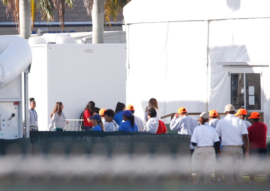 Migrant children who have been separated from their families can be seen in tents at a detention center in Homestead, Florida on June 28, 2019. (Credit: RHONA WISE/AFP/Getty Images)