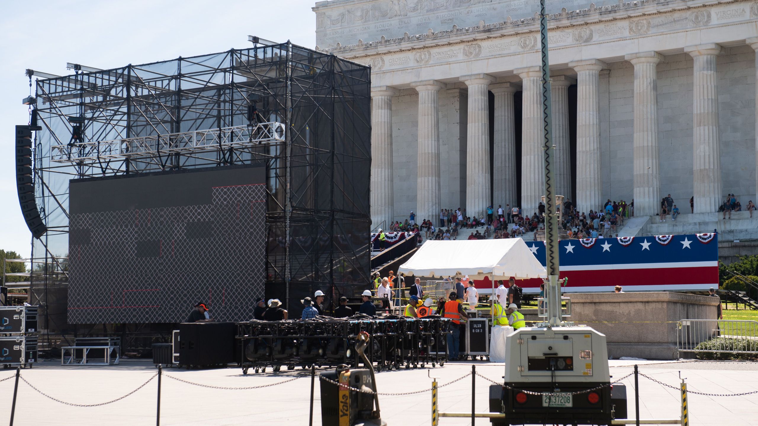 Workers build a stage and bleachers for the "Salute to America" Fourth of July event with Donald Trump at the Lincoln Memorial on the National Mall in Washington, D.C., on July 1, 2019. (Credit: Saul Loeb/AFP/Getty Images)