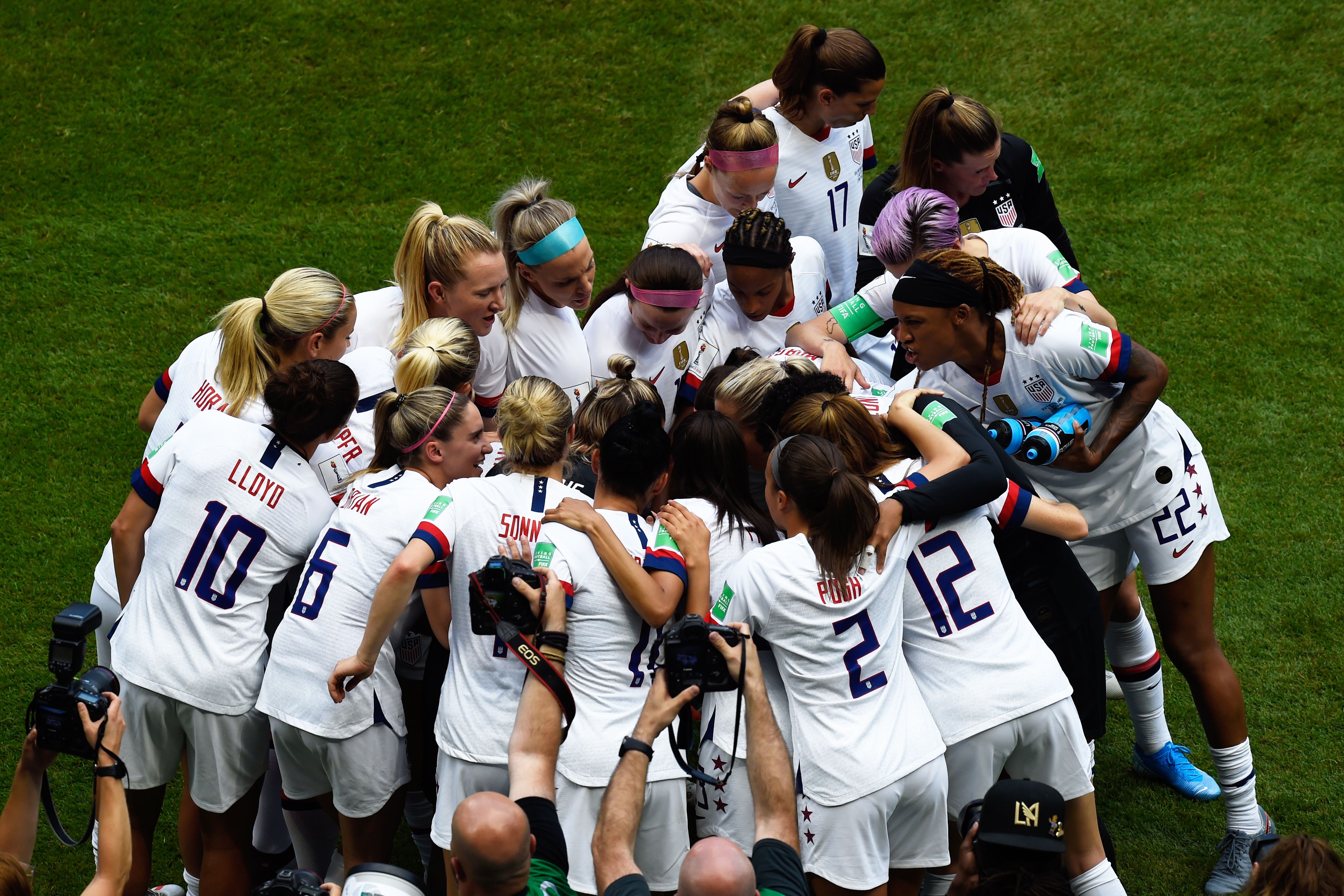 U.S. players huddle prior to the France 2019 Womens World Cup football final match between USA and the Netherlands, on July 7, 2019 at the Lyon Stadium in France. (Credit: Jean-Philippe KSIAZEK / AFP)