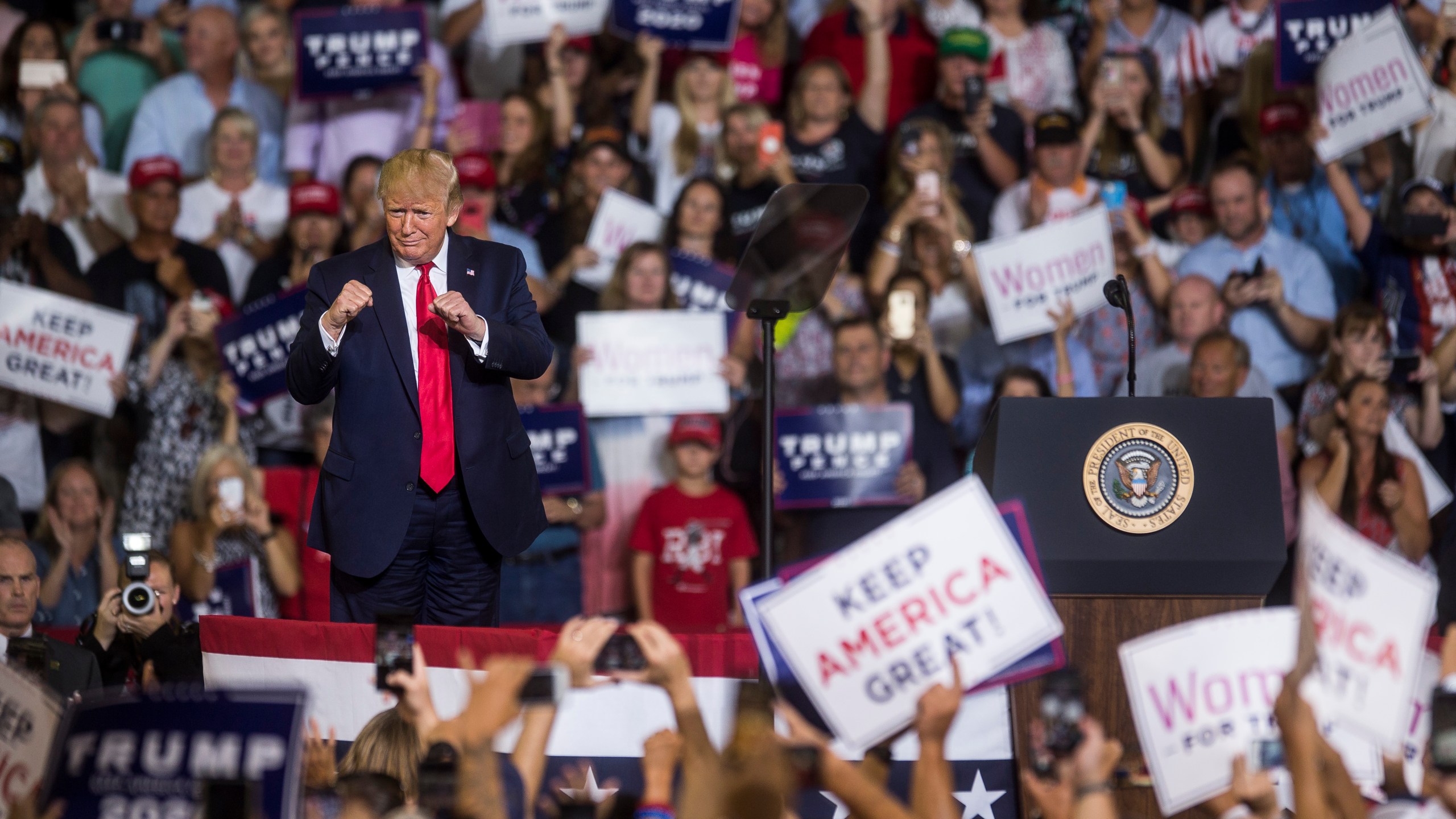 President Donald Trump takes the podium before speaking during a campaign rally in Greenville, North Carolina, on July 17, 2019. (Credit: Zach Gibson / Getty Images)