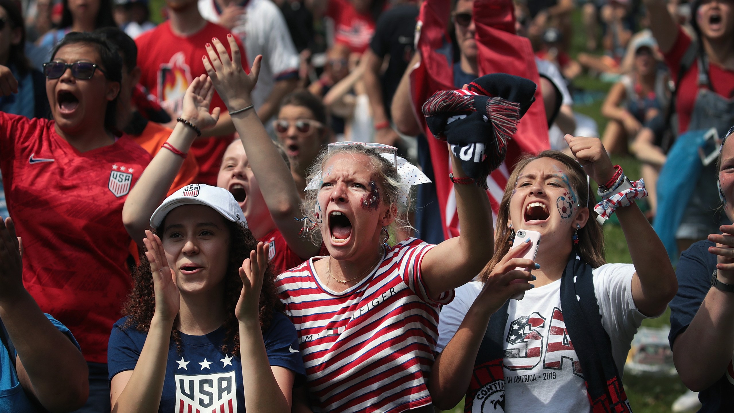 Fans watch the U.S. women’s national soccer team play England in the Women’s World Cup semifinal match at a viewing party hosted by U.S. Soccer in Lincoln Park on July 2, 2019 in Chicago, Illinois. (Credit: Scott Olson/Getty Images)