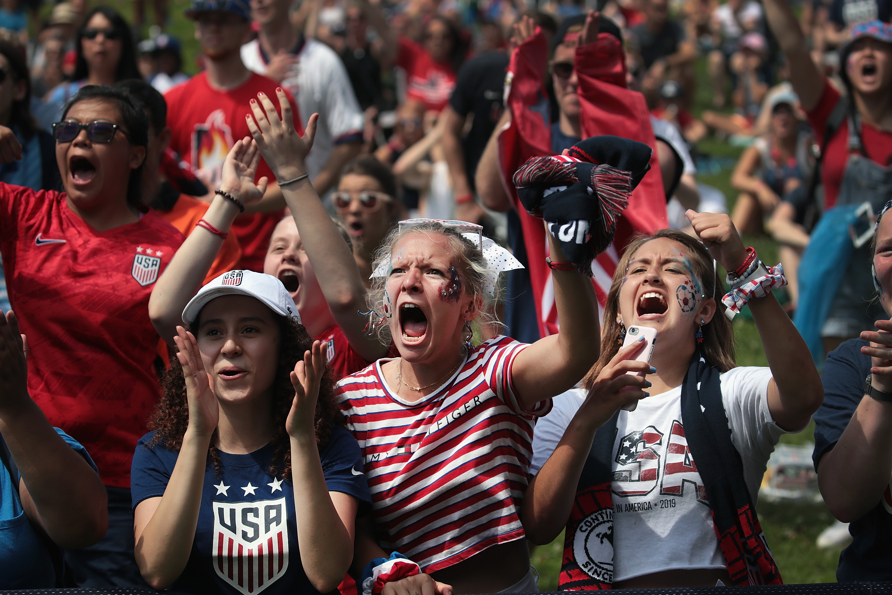 Fans watch the U.S. women’s national soccer team play England in the Women’s World Cup semifinal match at a viewing party hosted by U.S. Soccer in Lincoln Park on July 2, 2019 in Chicago, Illinois. (Credit: Scott Olson/Getty Images)