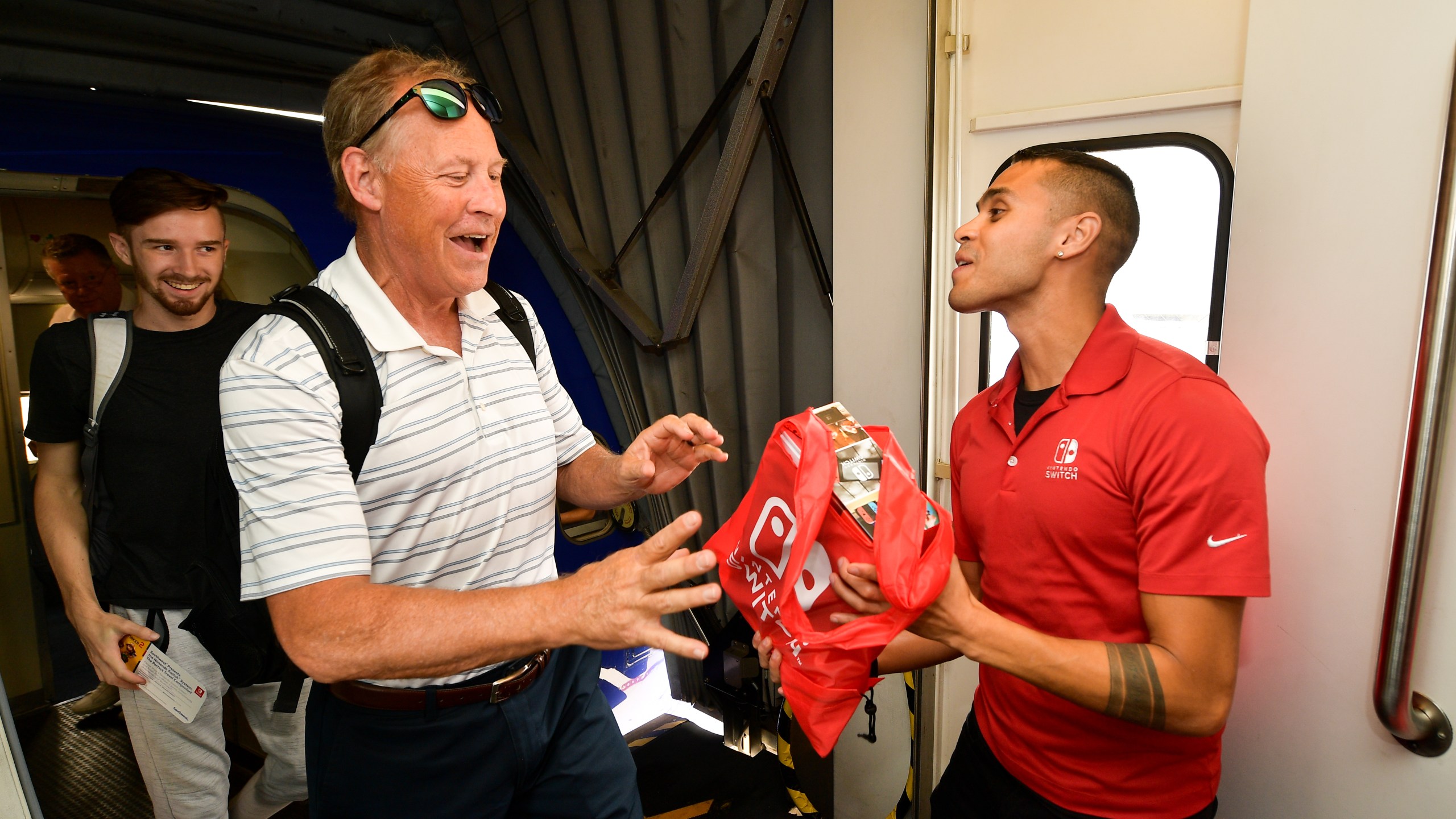 Southwest Airlines passengers are surprised with their own Nintendo Switch system at San Diego International Airport on July 17, 2019. (Credit: Matt Winkelmeyer/Getty Images for Nintendo)