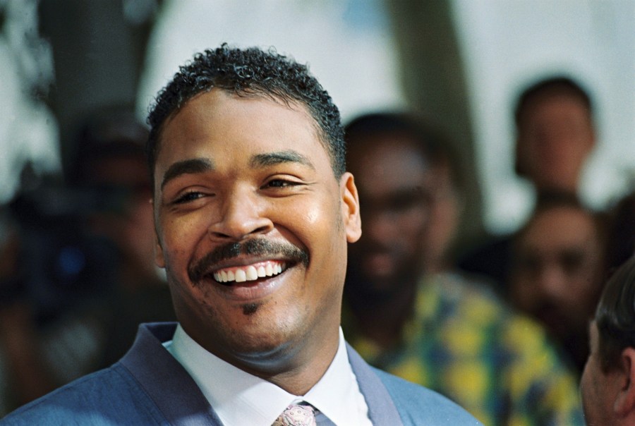 Rodney King, the Los Angeles motorist whose beating by police was captured on videotape, smiles during a press conference where he called for the end of violence in the city on May 1, 1992, in Beverly Hills. (Credit: Robert Sullivan / AFP / Getty Images)