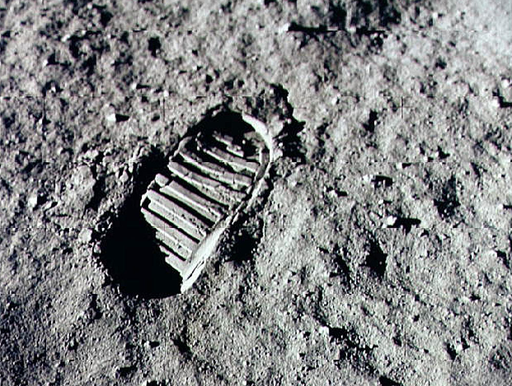 Neil Armstrong steps into history July 20, 1969 by leaving the first human footprint on the surface of the moon. (Credit: NASA/Newsmakers)