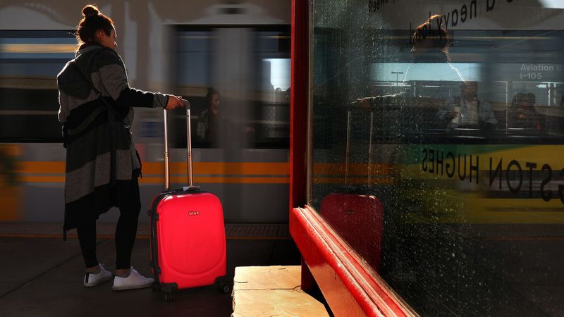 A rider waits to board a train at Aviation/LAX Station in January 2018. The station is one of seven that will be closed during weekends starting July 12. (Credit: Christina House/ Los Angeles Times)