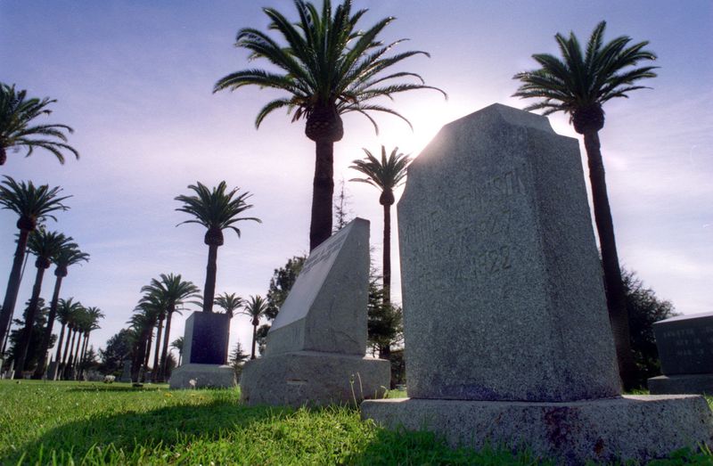 Palm trees surround the graves and headstones in Santa Ana Cemetery, seen here in 1996. (Credit: Christine Cotter/ Los Angeles Times)